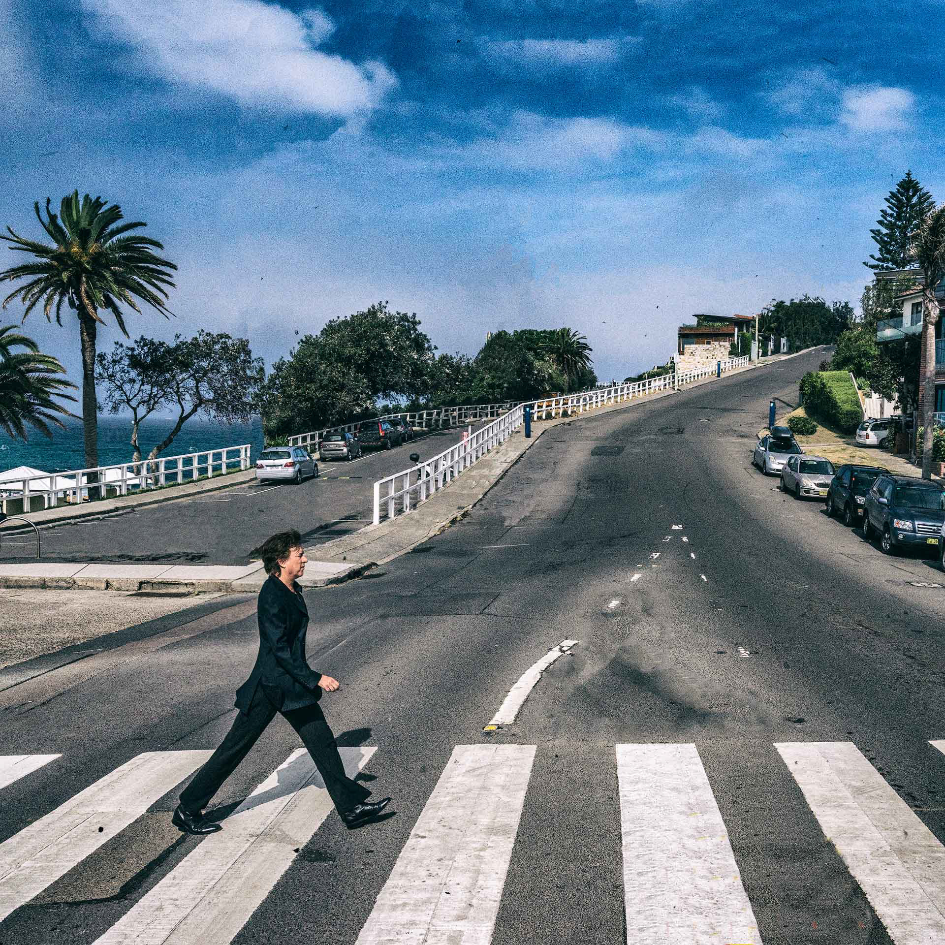 Dave Chambers walking across crossing in Bronte, NSW like The Beatles Abbey Road album cover.