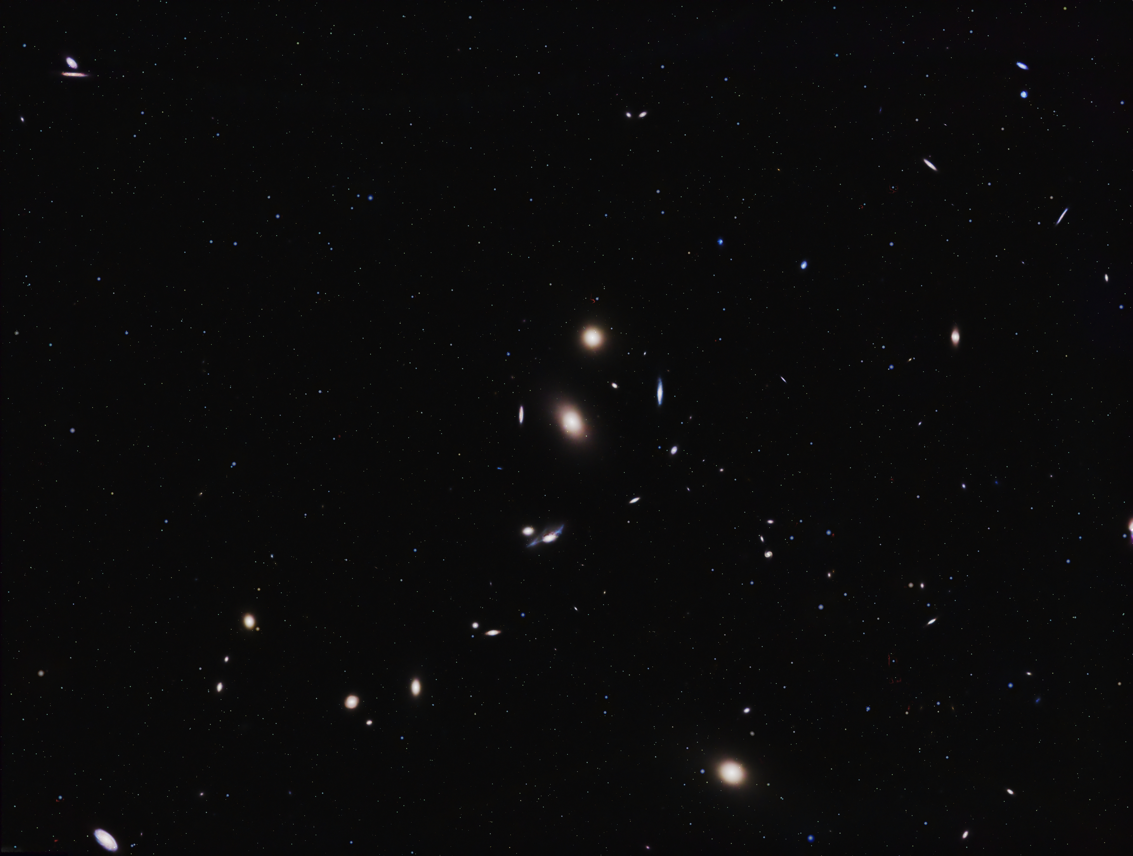 The Virgo Cluster is a large cluster of galaxies in the constellation Virgo. Comprising approximately 1,300 (and possibly up to 2,000) member galaxies, the cluster forms the heart of the larger Virgo Supercluster, of which the Local Group (containing our Milky Way galaxy) is a member.