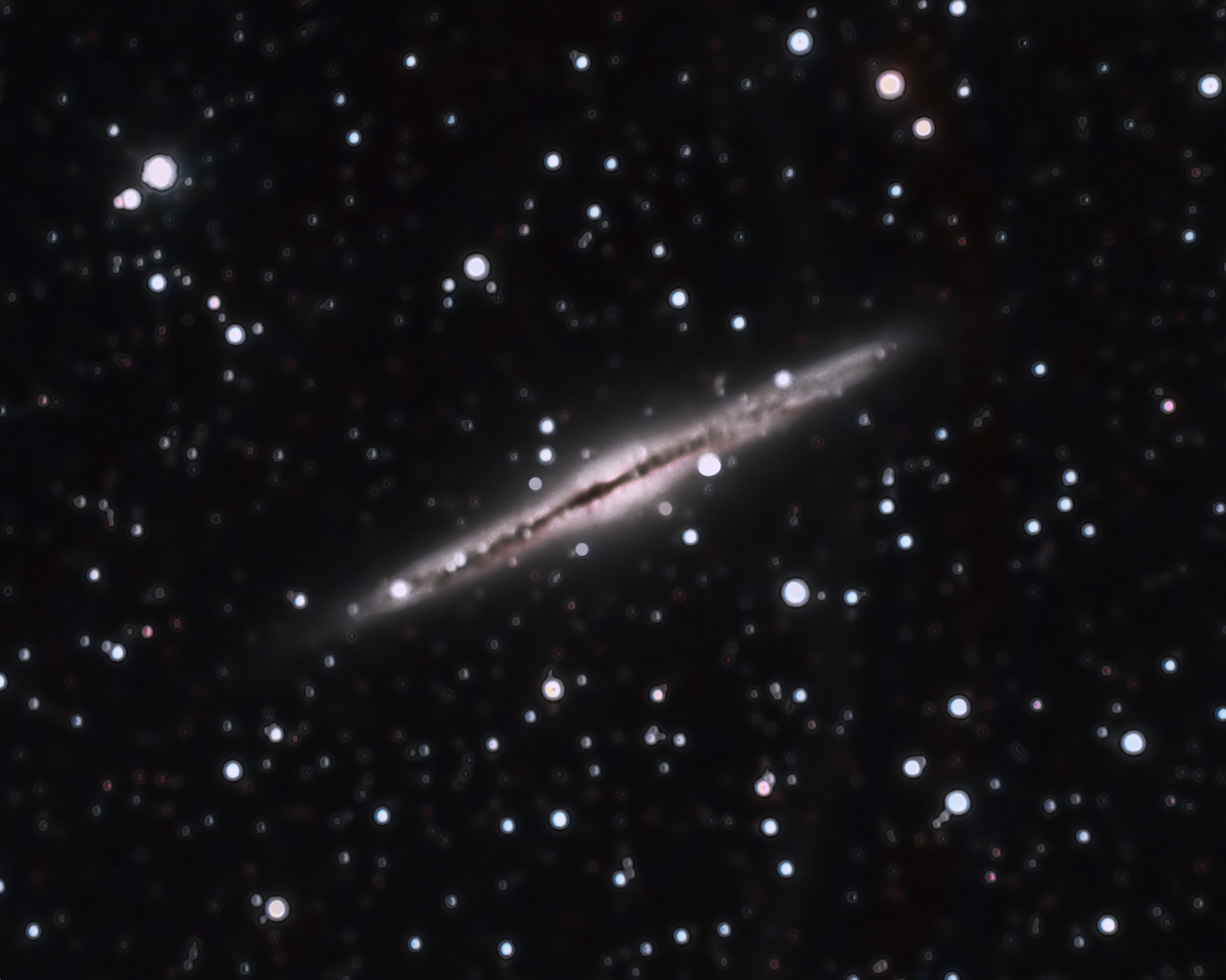 NGC 891, an edge view of a spiral galaxy. It is about 30 million light-years away in the constellation Andromeda. — at Lockwood Valley, California.