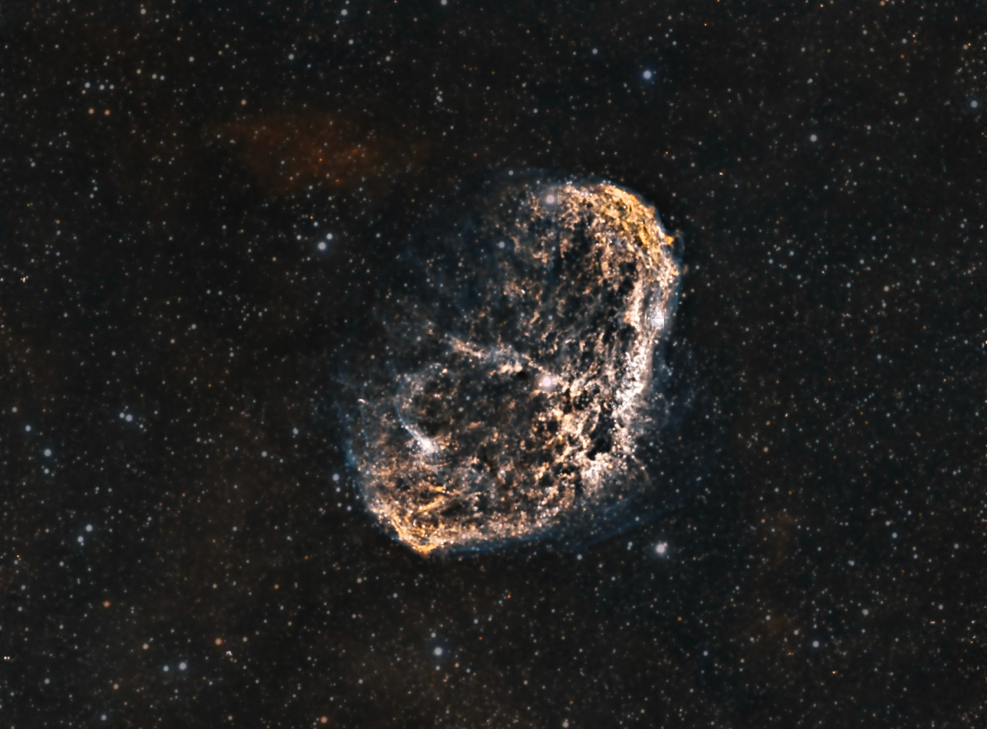 The Crescent Nebula is an emission nebula in the constellation Cygnus, about 5000 light-years away from Earth. The wavey "texture" is from the collision of stellar winds, like our solar winds, from two different stars, each exciting the other to glow. This image was made from only the light from Hydrogen and Oxygen, two different wavelengths.