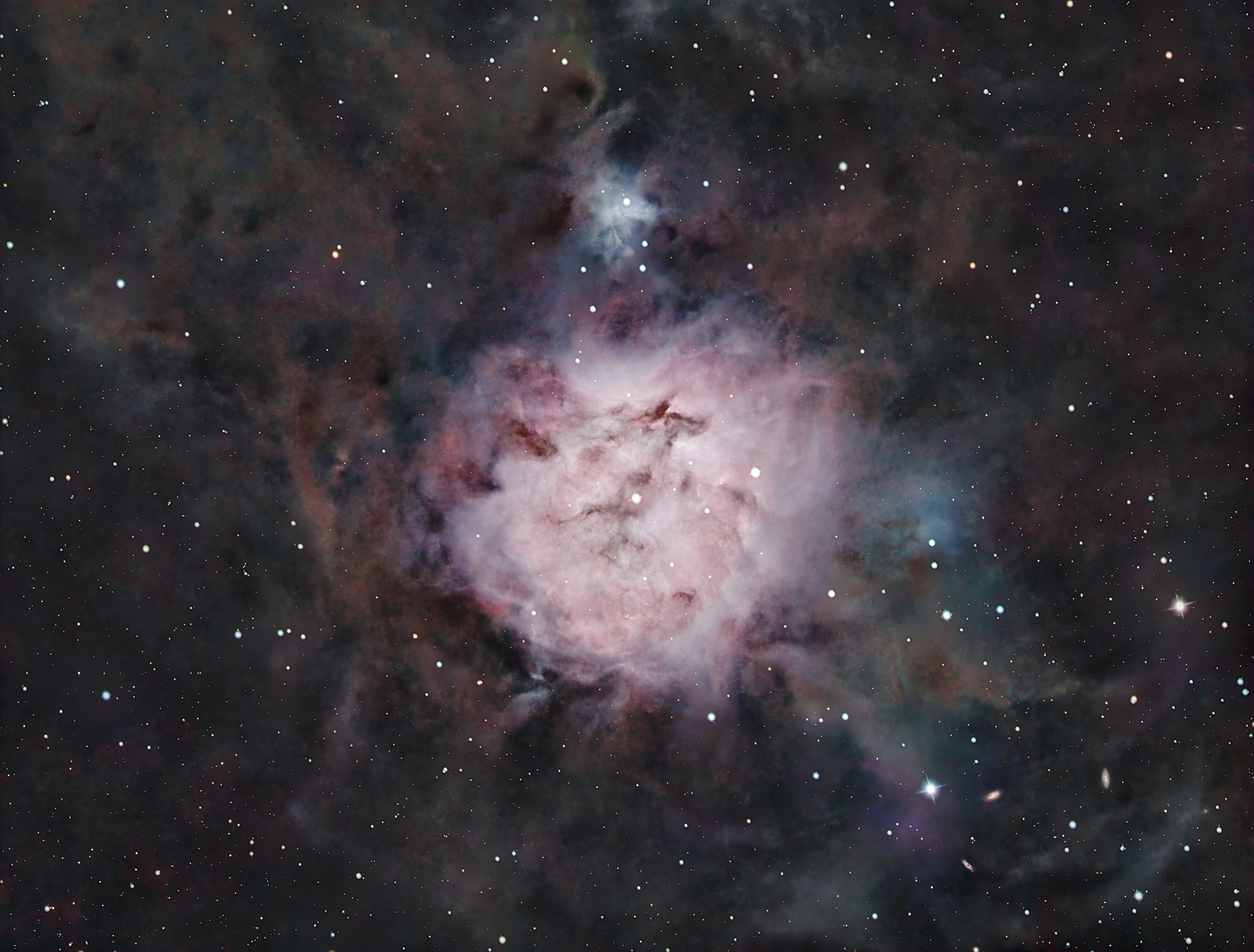 The Cocoon Nebula in RGB. IC 5146 is a reflection and emission nebula in the constellation Cygnus, including a cluster of stars surrounded by a bright and dark nebula.  This image was captured in 6 sessions from 2021 to 2024 and includes 437 separate Red. Green, and Blue images.
