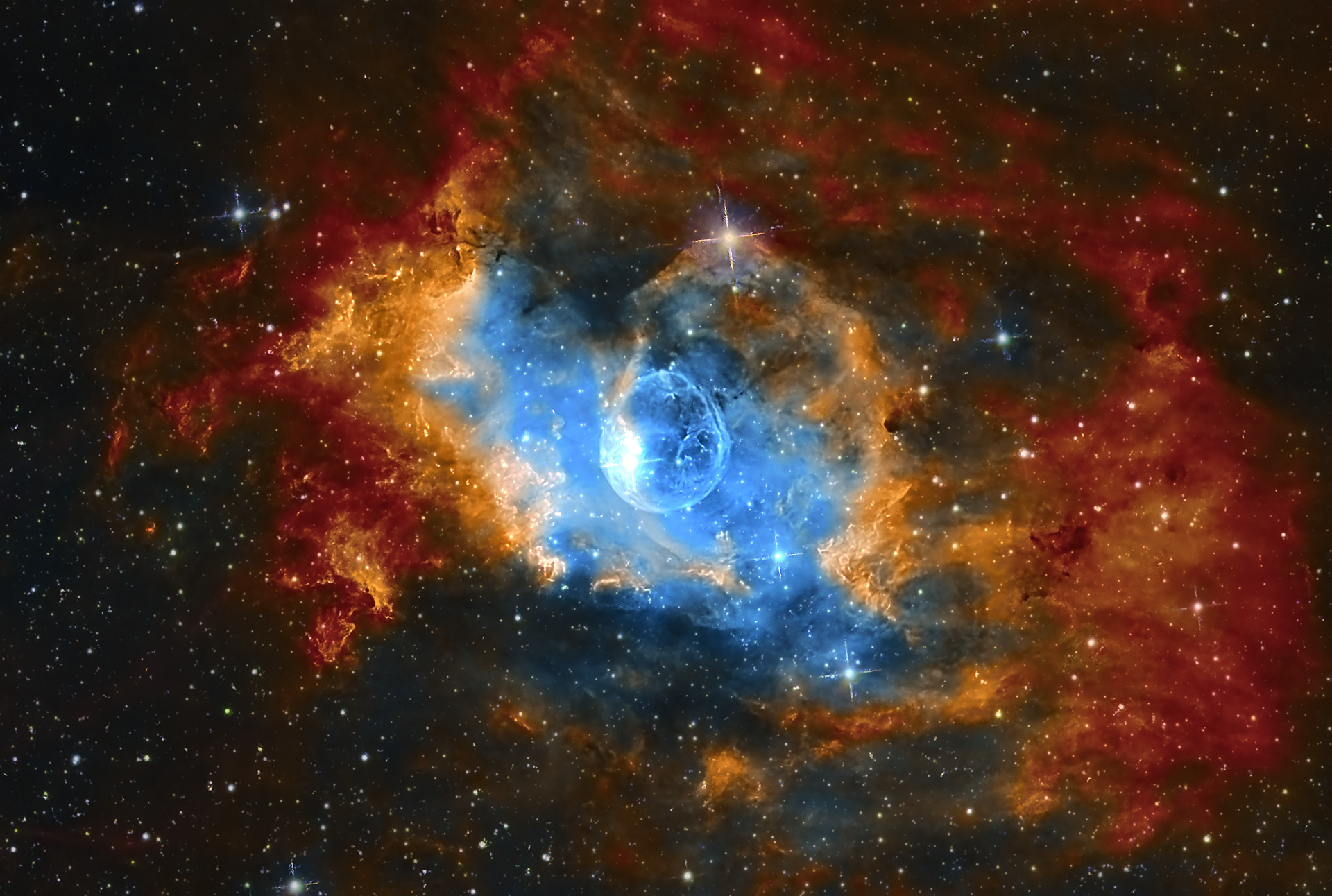 The Bubble Nebula (NGC 7635) is an emission nebula located in the constellation Cassiopeia. The nebula lies at a distance of 7,100 to 11,000 light years from Earth. It was nicknamed the Bubble Nebula because of its shape, which was created by a strong stellar wind from a young, massive, hot star that shed its material to form the nebula. The Bubble Nebula has an apparent magnitude of 10 and is about 10 light years in diameter. SHO