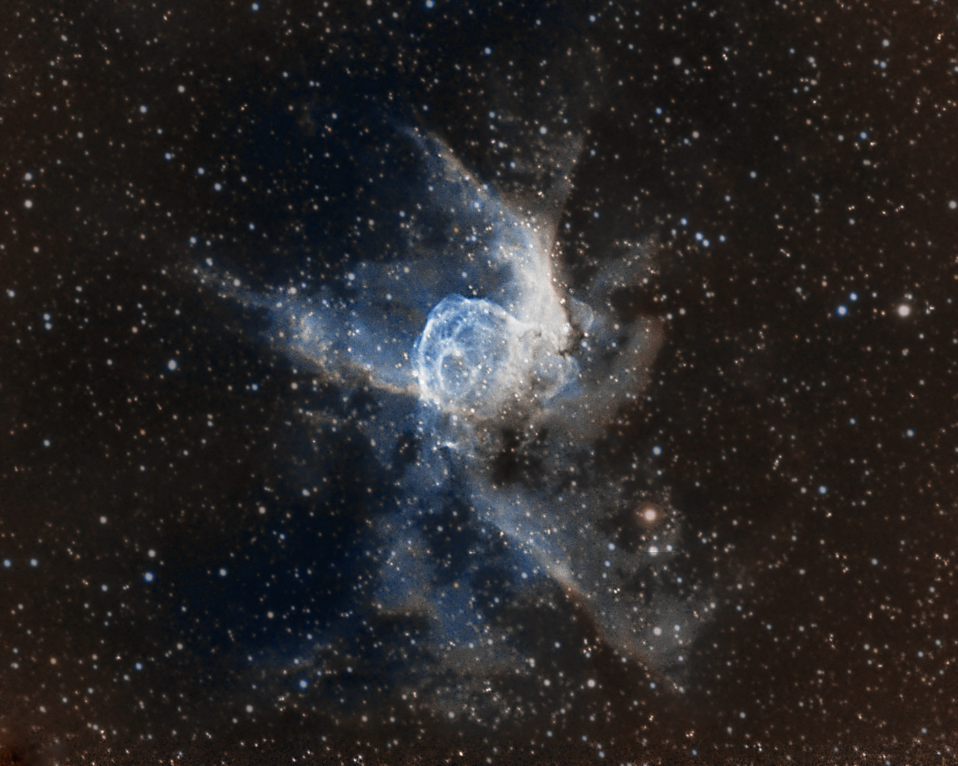 NGC 2359 Thor's Helmet - an emission nebula in the constellation Canis Major. The nebula is approximately 11.96 thousand light years away and 30 light-years in size. The central star is the Wolf-Rayet star WR7, an extremely hot star thought to be in a brief pre-supernova stage of evolution. It is similar in nature to the Bubble Nebula, but interactions with a nearby large molecular cloud are thought to have contributed to the more complex shape and curved bow-shock structure of Thor's Helmet. It is located about 10,000 light years from Earth. It is a hotbed of new star formation. This is a combination of both Ha and OIII to create a bi color image.