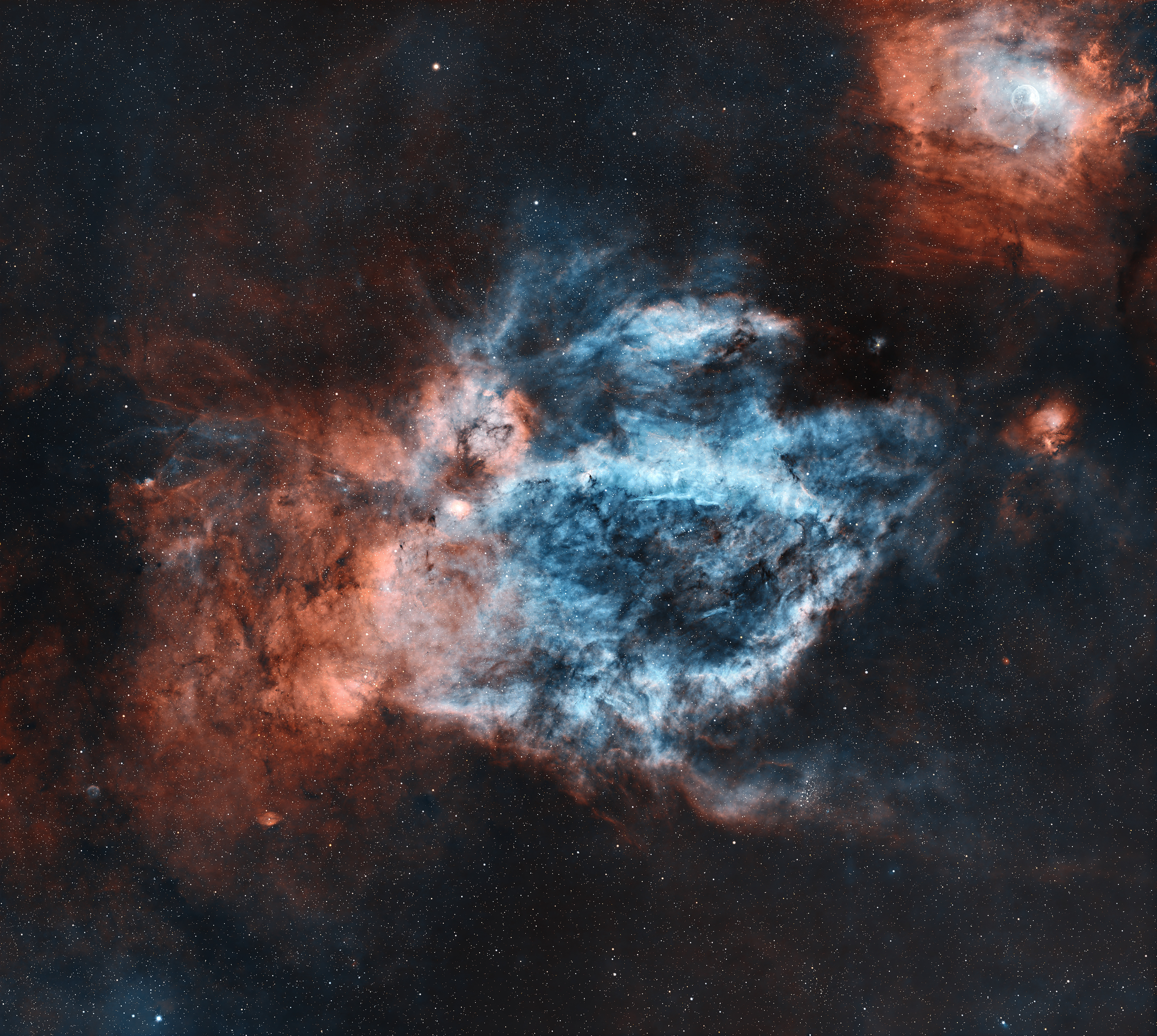 The Lobster Claw Nebula is the common name for the emission nebula Sh2-157, located in the constellation Cassiopeia. It is an HII region that glows due to ionized hydrogen (red) and oxygen (blue) gases. In the upper right is another interesting target, NGC 7635, also known as the Bubble Nebula.  It is an H II region emission nebula and contains a "bubble", created by the stellar wind from a massive hot, 8.7 magnitude young central star.