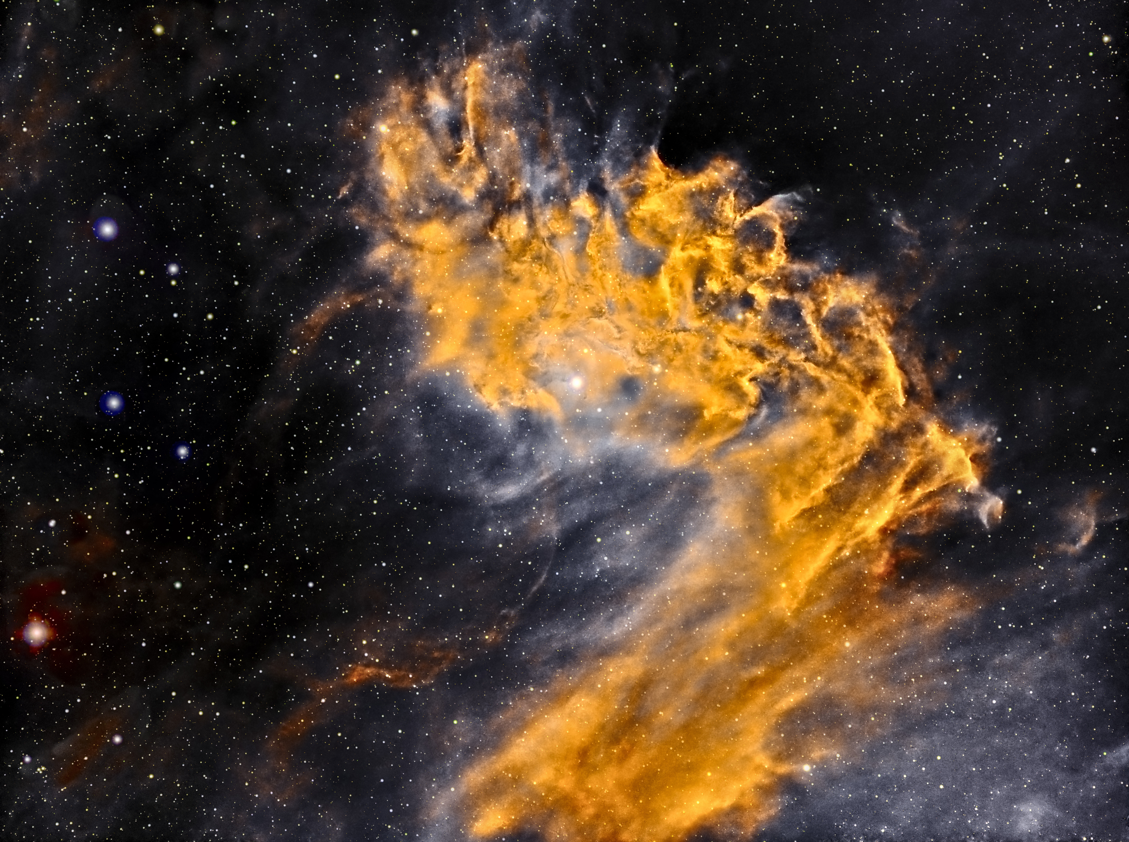 IC405 Flaming Star Nebula - an emission and reflection nebula surrounding the bluish, irregular variable star AE Aurigae. It shines at magnitude +6.0. The nebula measures approximately 37.0' x 19.0', and lies about 1,500 light-years away from Earth. The nebula is about 5 light-years across. It is located about 10,000 light years from Earth. It is a hotbed of new star formation. This is a combination of Sulfur, Ha and OIII (SHO aka Hubble Palette) to create a color image.