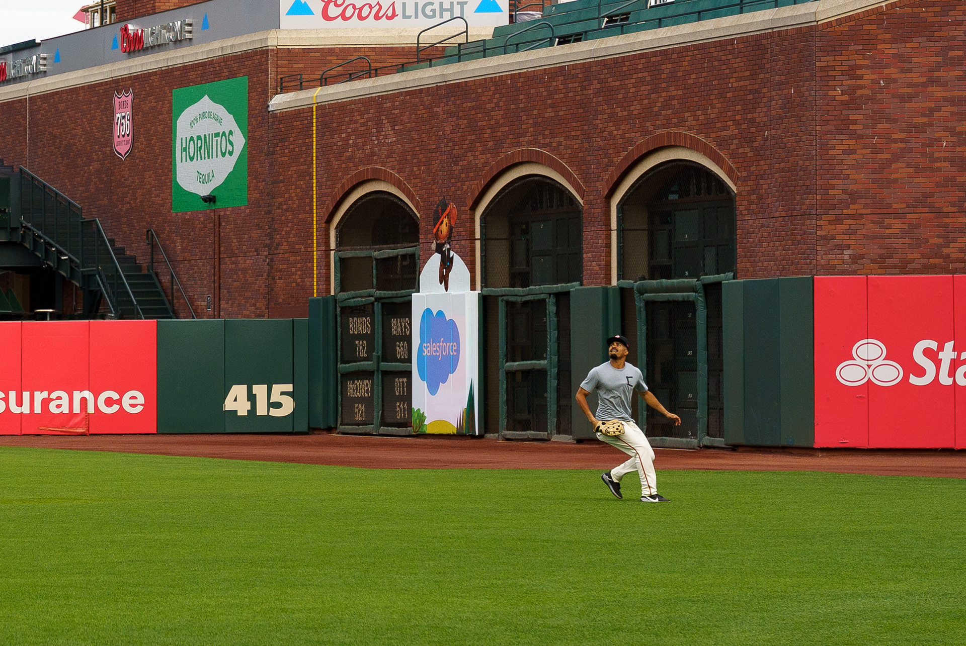 LaMonte Wade Jr. prepares to catch a fly ball during practice.