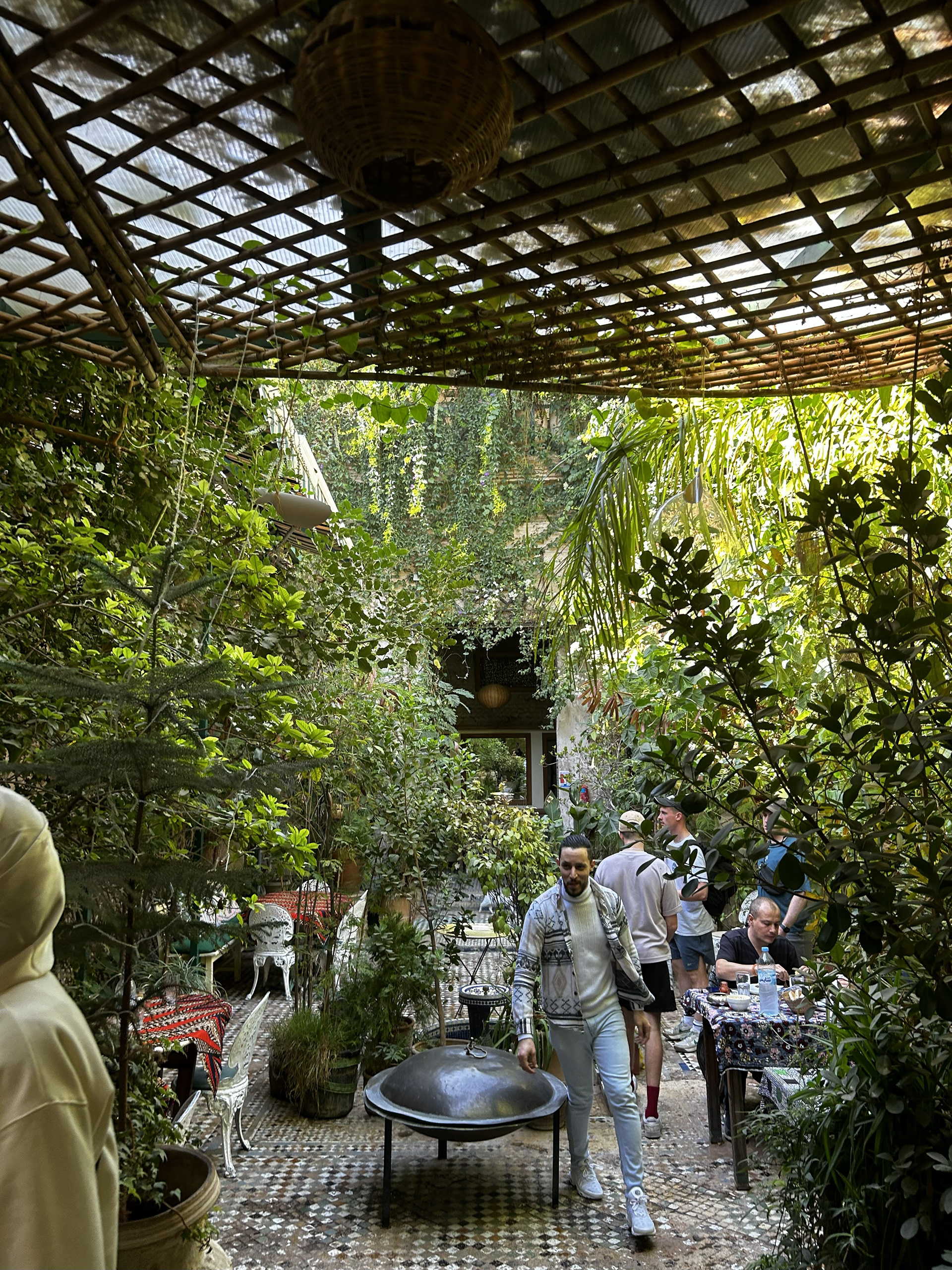 a beautiful garden space with tables set amongst the flora