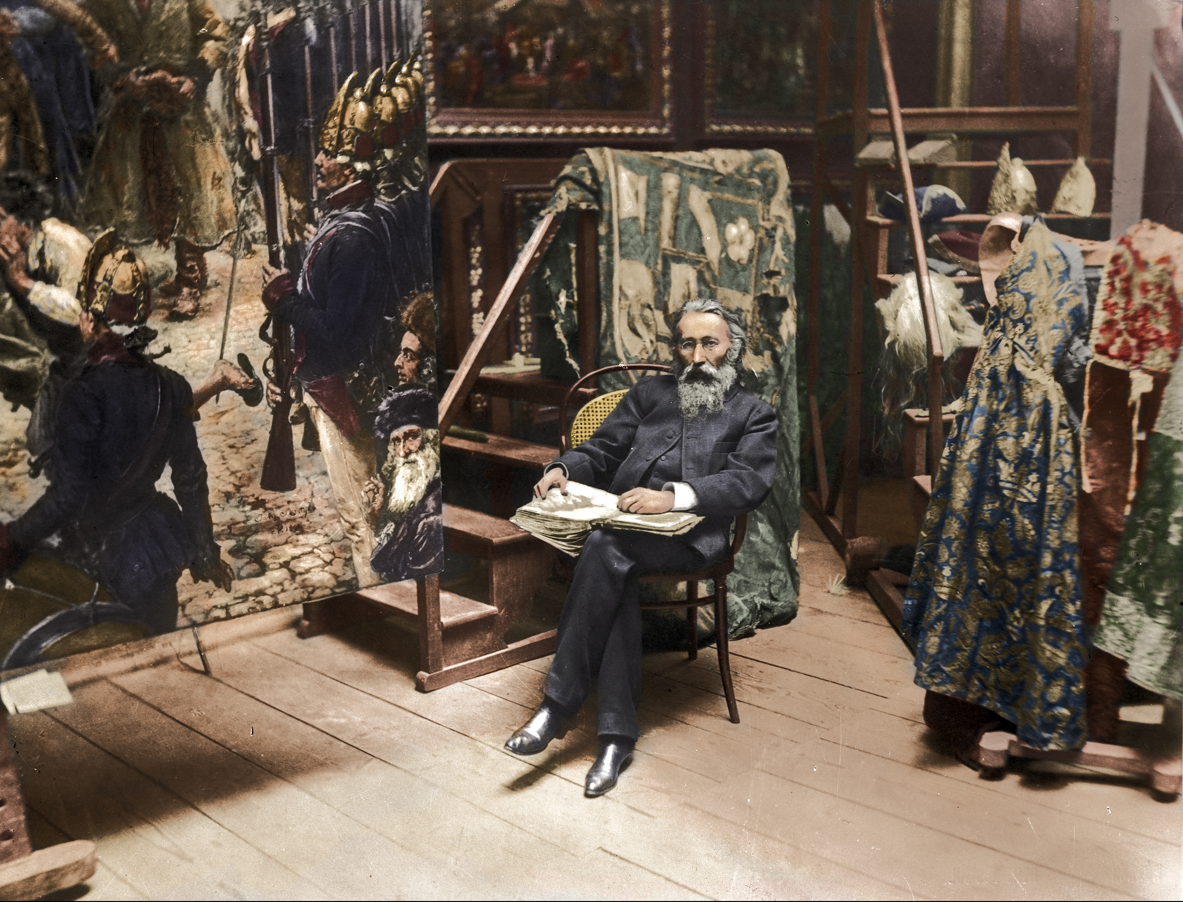 Jan Matejko siedzący w pracowni przy obrazie "Konstytucja 3 Maja 1791 r."