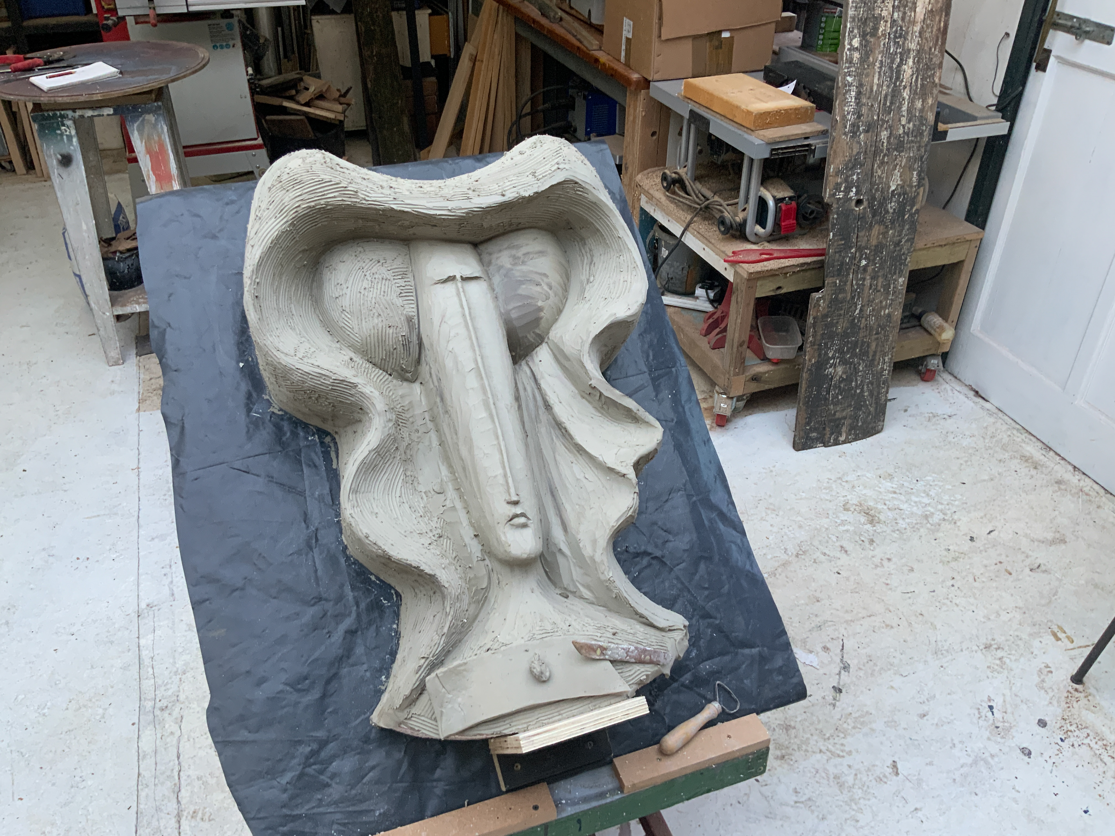 Beginning to model the portrait in clay