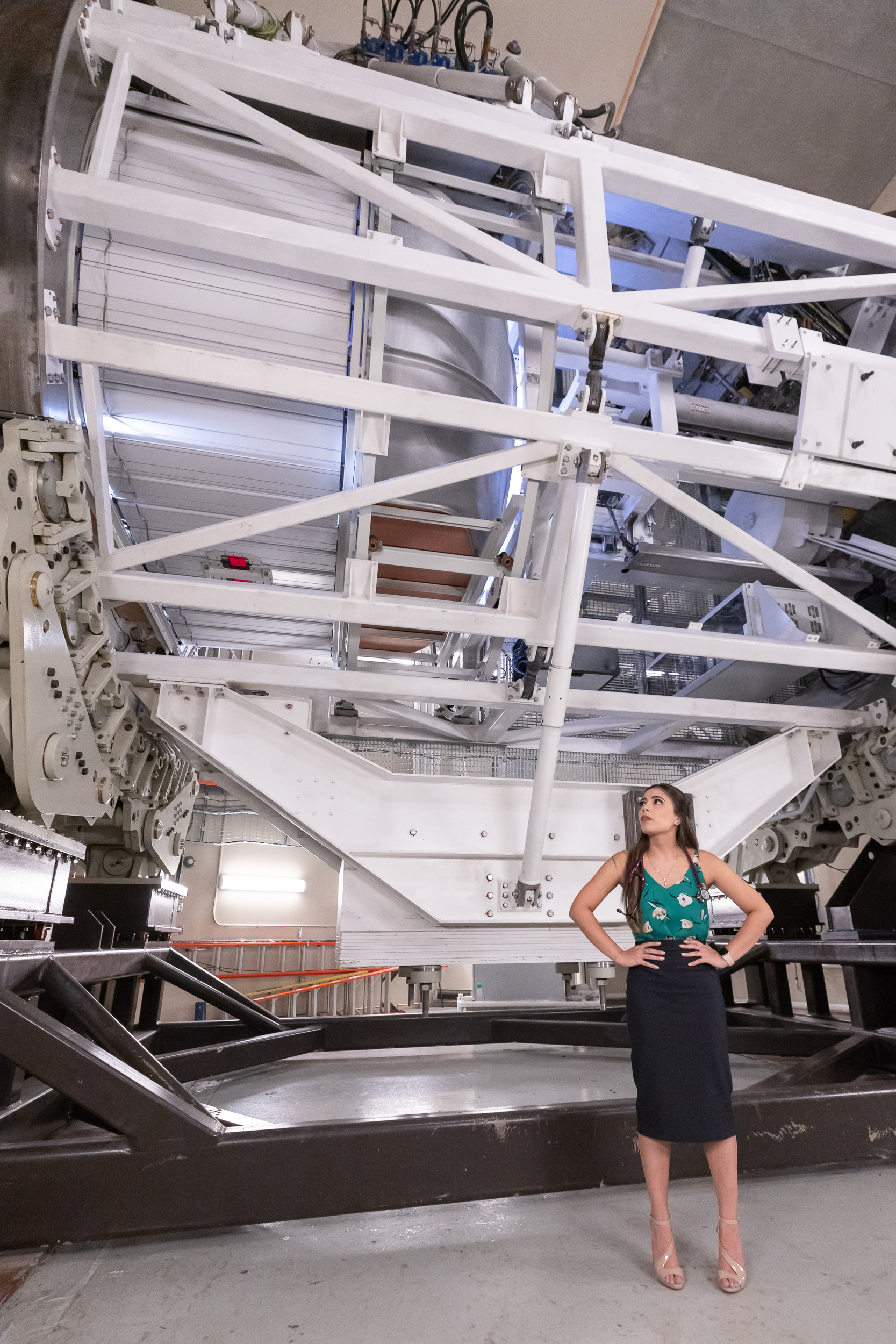 Nursing psychology major Alyssa Tijerina stands next to a proton therapy gantry Sept. 1, 2020 at the Texas Center for Proton Therapy in Irving.