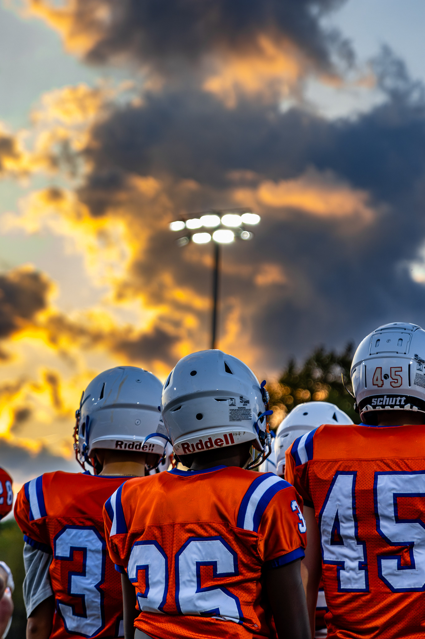 Newton South Players watch from the sideline under the lights. Shot on Canon R7. 9/13/2024 