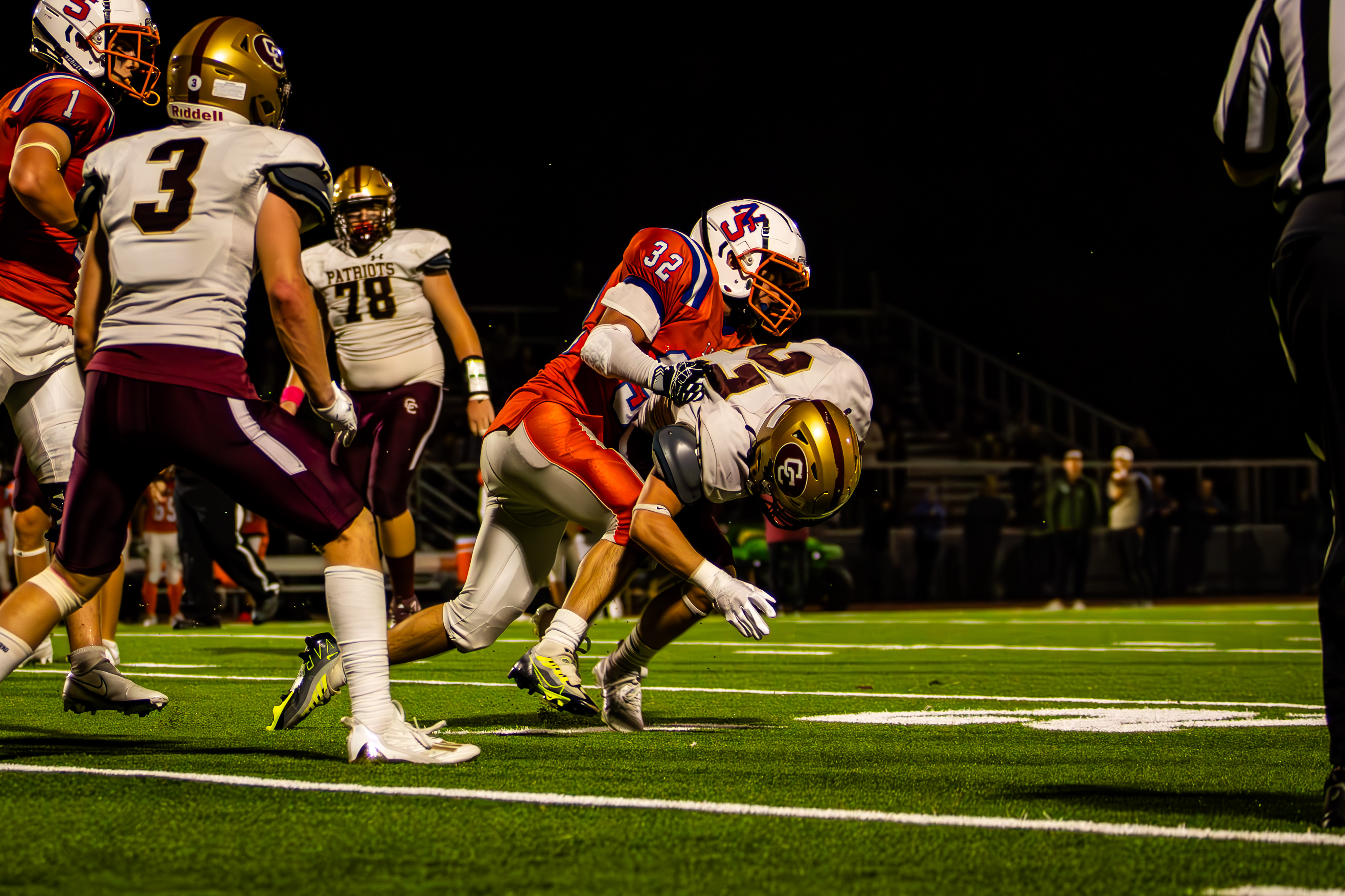 Newton South Football Player puts in a crunching tackle. Shot on Canon T7, Canon EF 70-200 f2.8.  10/6/2023