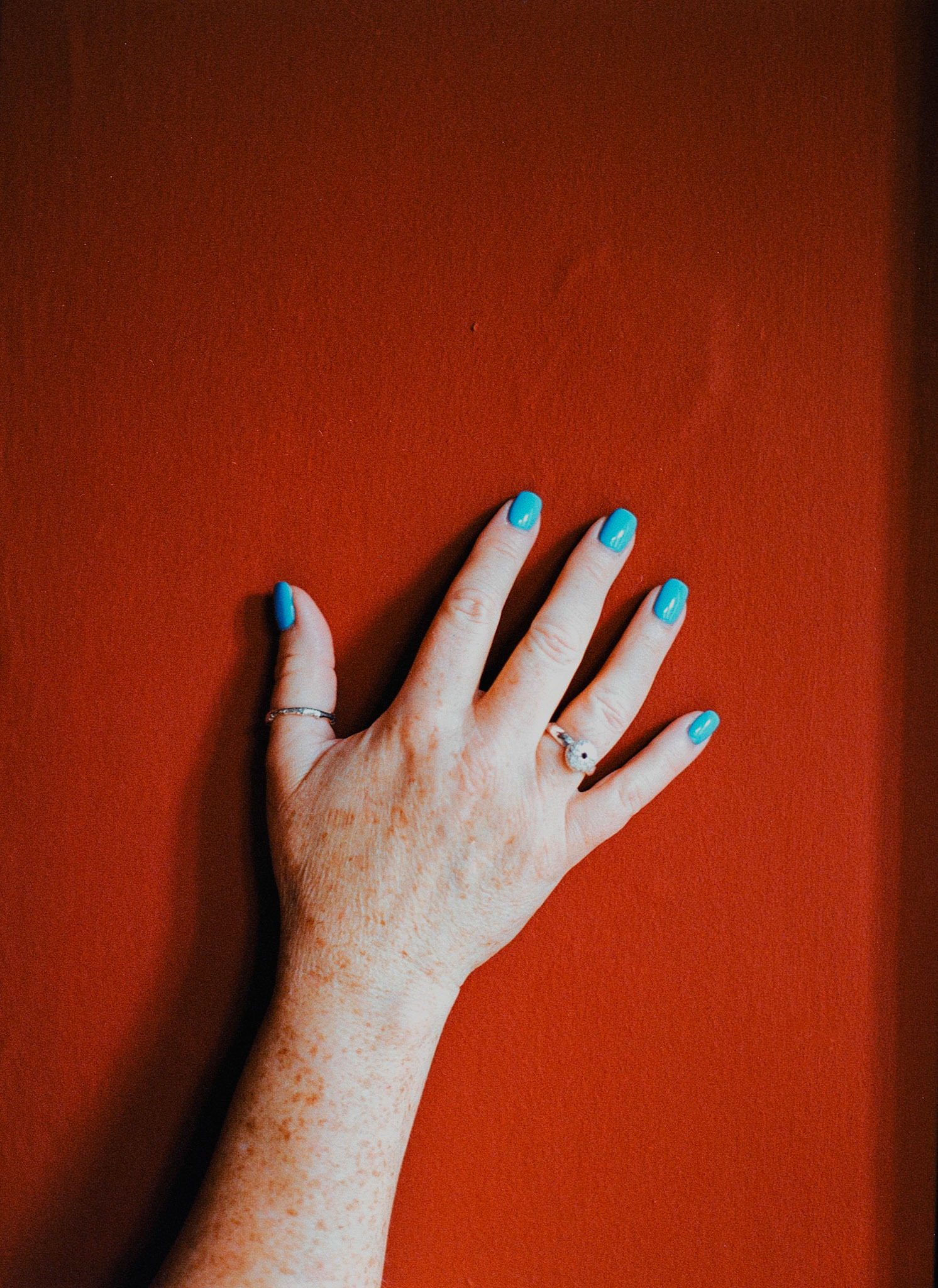 Red Hand Blue Nails