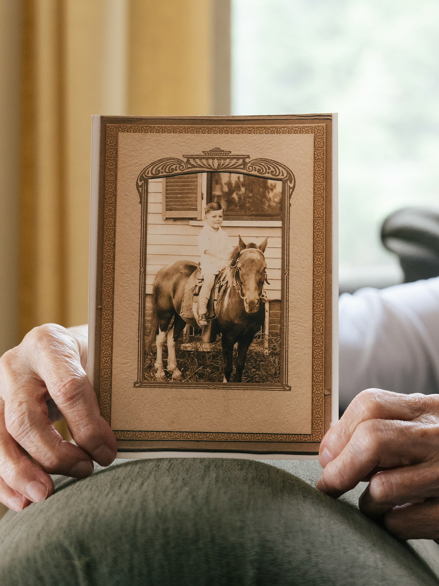 Richard on a pony. A photographer wandered the neighbourhood with a pony to lure people to have their photo taken.