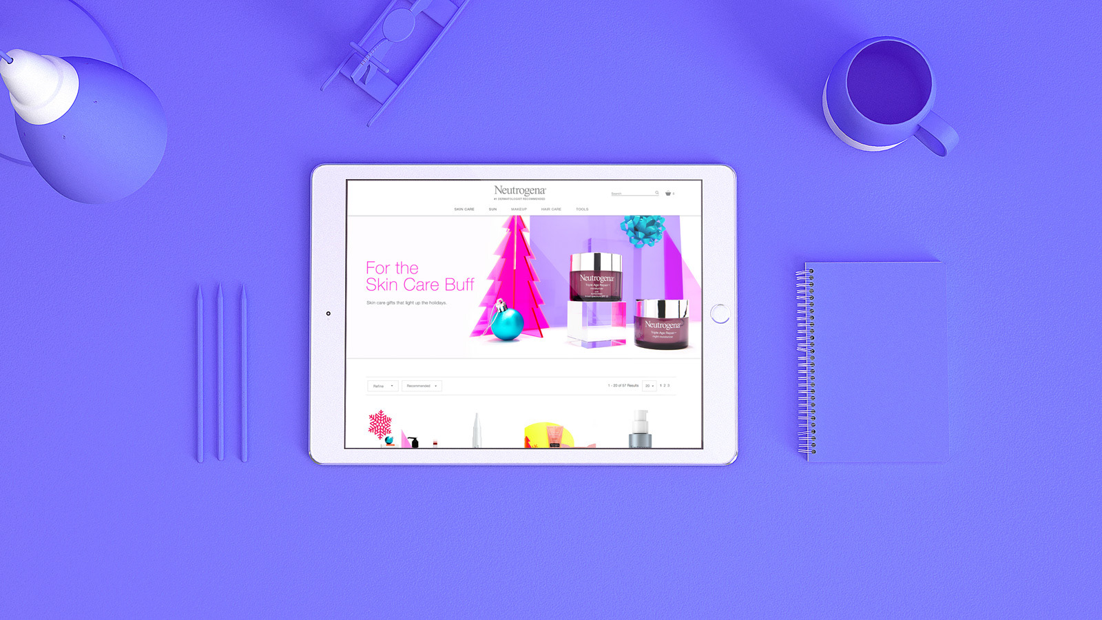 An iPad against a neon purple background showcases a screenshot of the holiday glow guide website.
