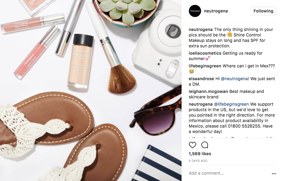 A screenshot of a Neutrogena Instagram post featuring lip glosses, foundation makeup, blush brush and summer props.