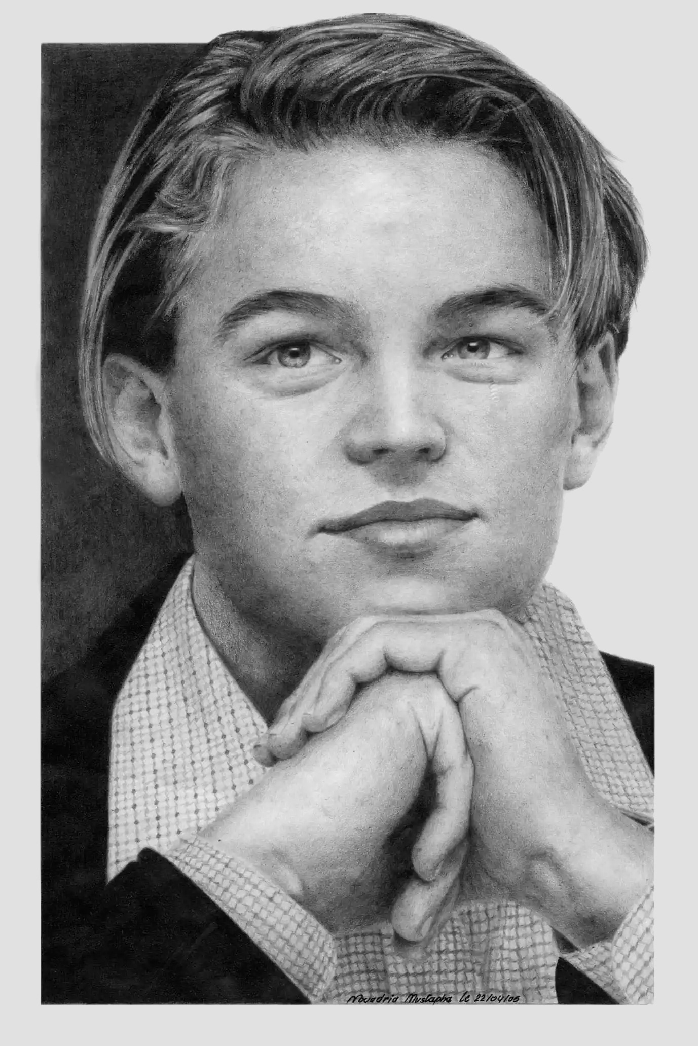 Pencil sketch of Leonardo Di Caprio with slicked-back hair, looking directly at the viewer with his hands clasped under his chin.