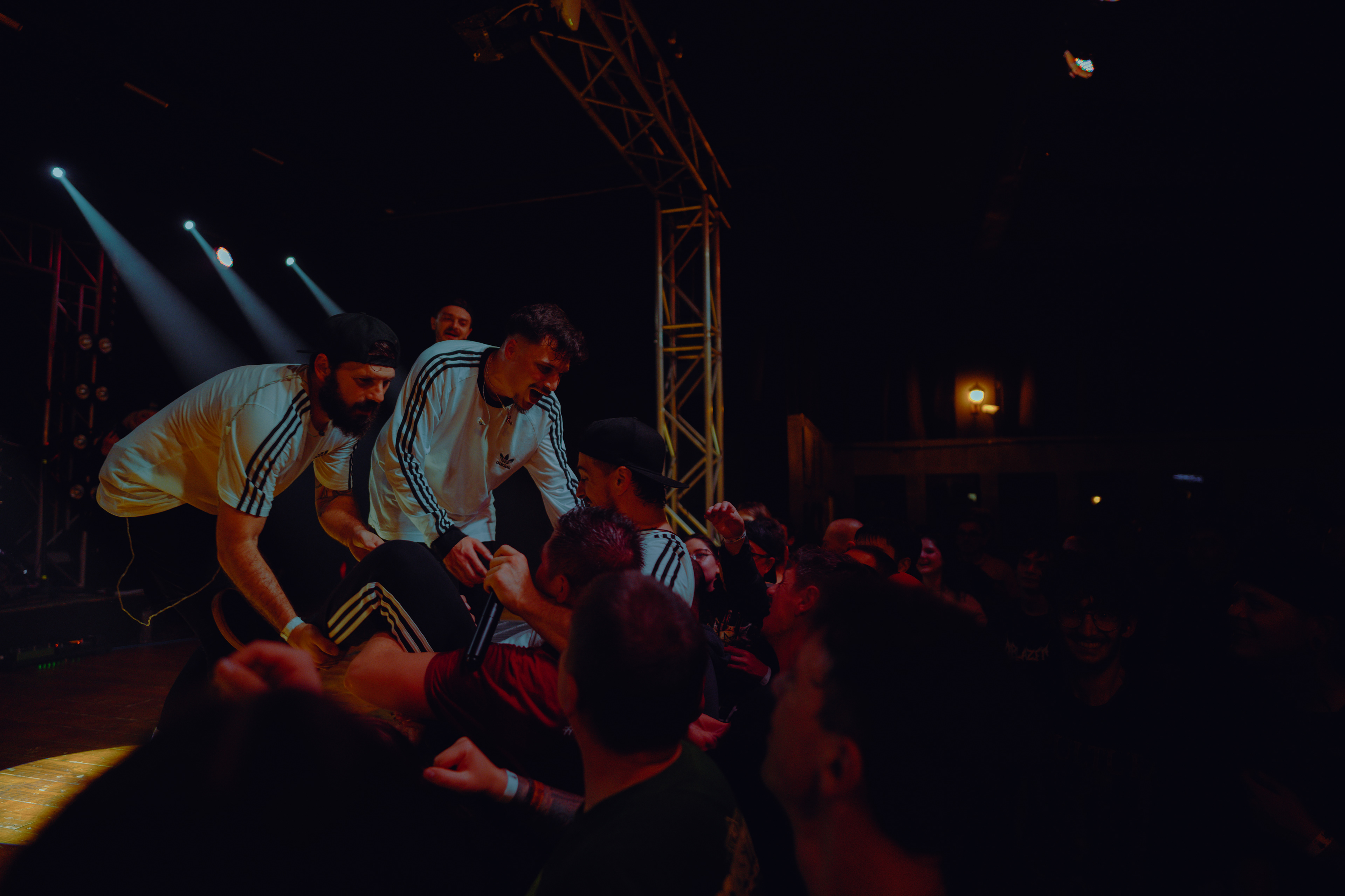 Concert photography of members of W3 4R3 NUM83R5 interacting warmly with fans, capturing memories together after the show at Rockstadt Club in Brașov, Romania.
