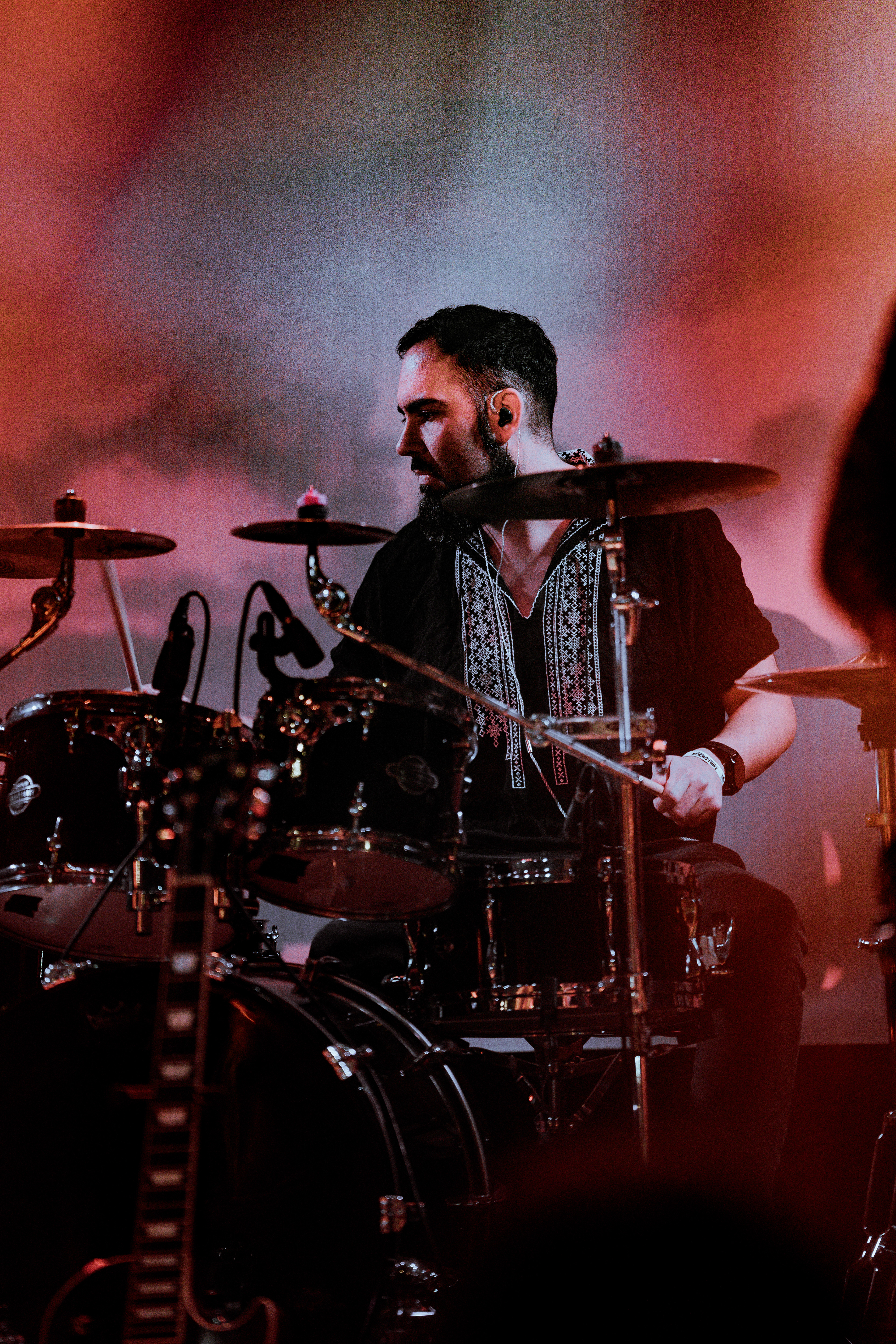 Sur Austru drummer captured in motion during energetic live show at Rockstadt Club, Brasov, Romania