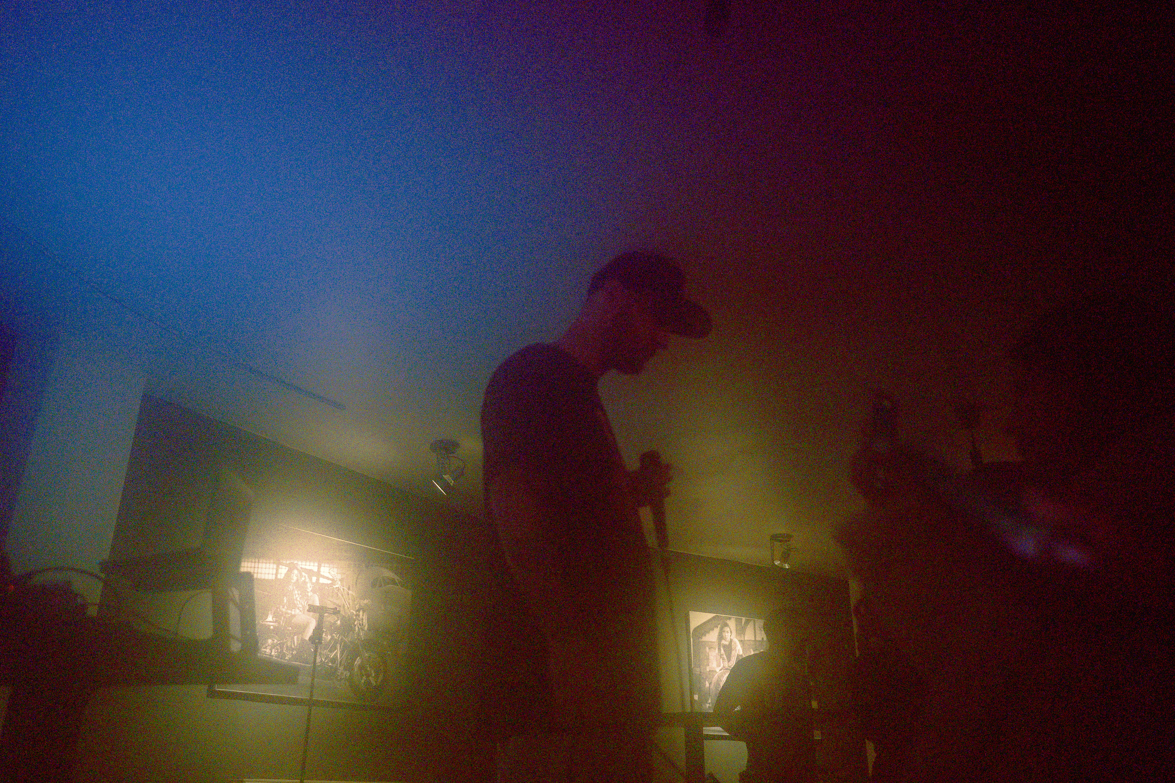 Blurry concert photography capturing Faust standing and watching the crowd during his hip hop show at Motorpub in Brașov, Romania.