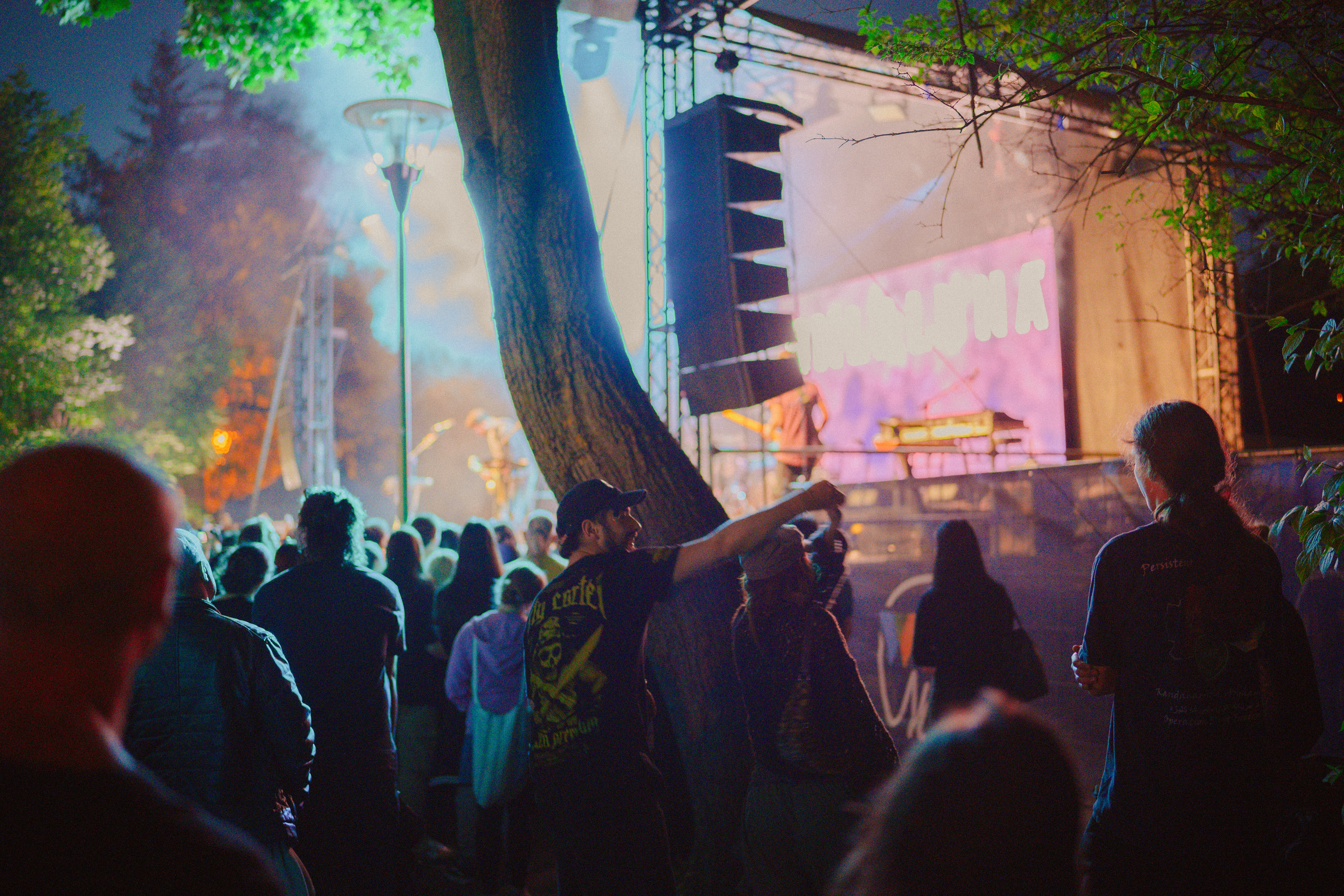 Concert photography of teenagers dancing energetically near the stage during Om La Luna’s live performance.
