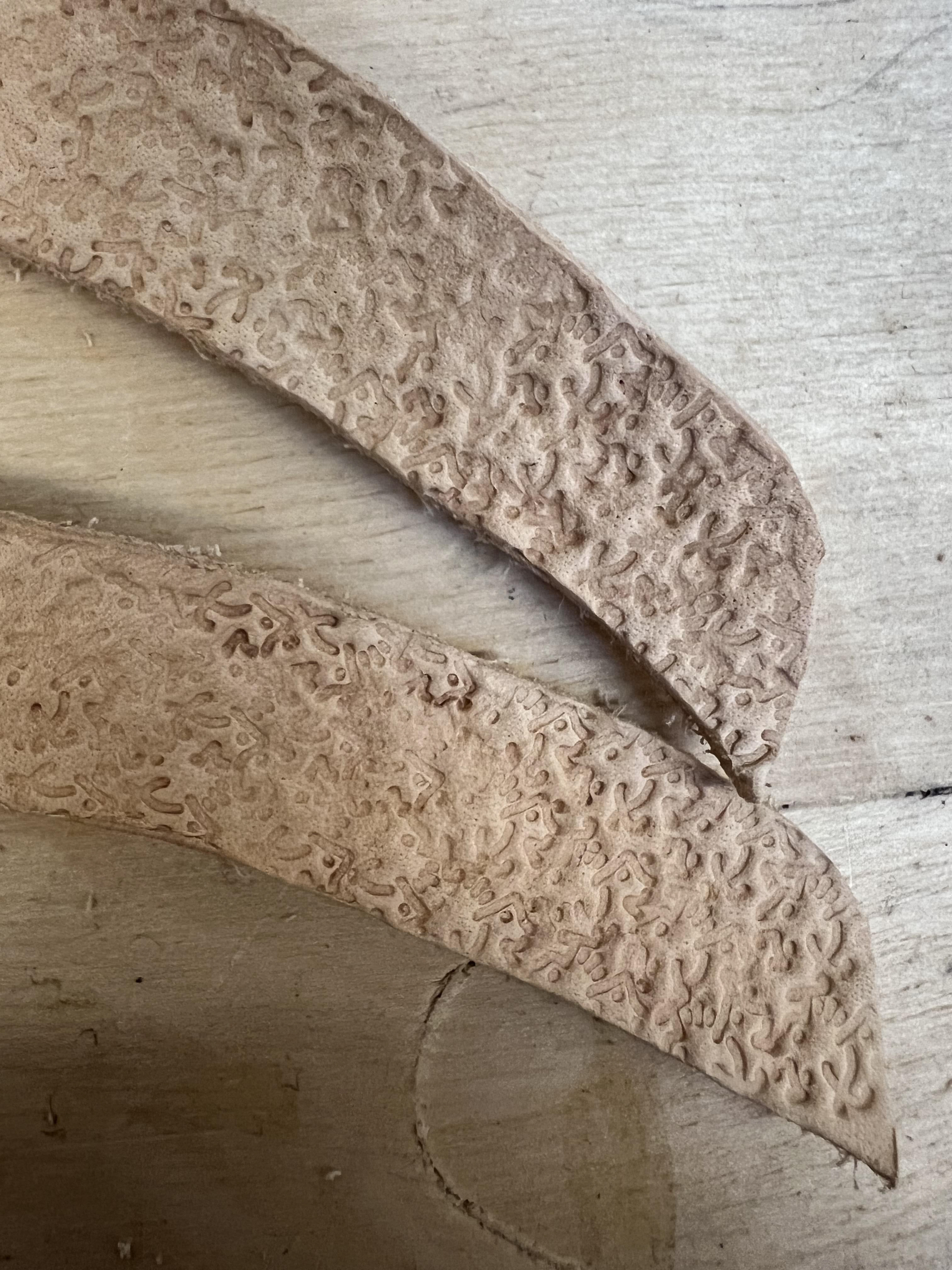 Embossing the leather for rough texture