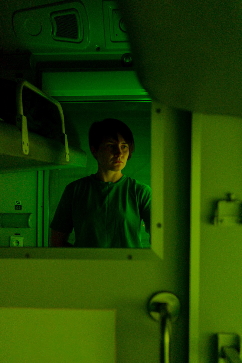 Self-portrait in door mirror