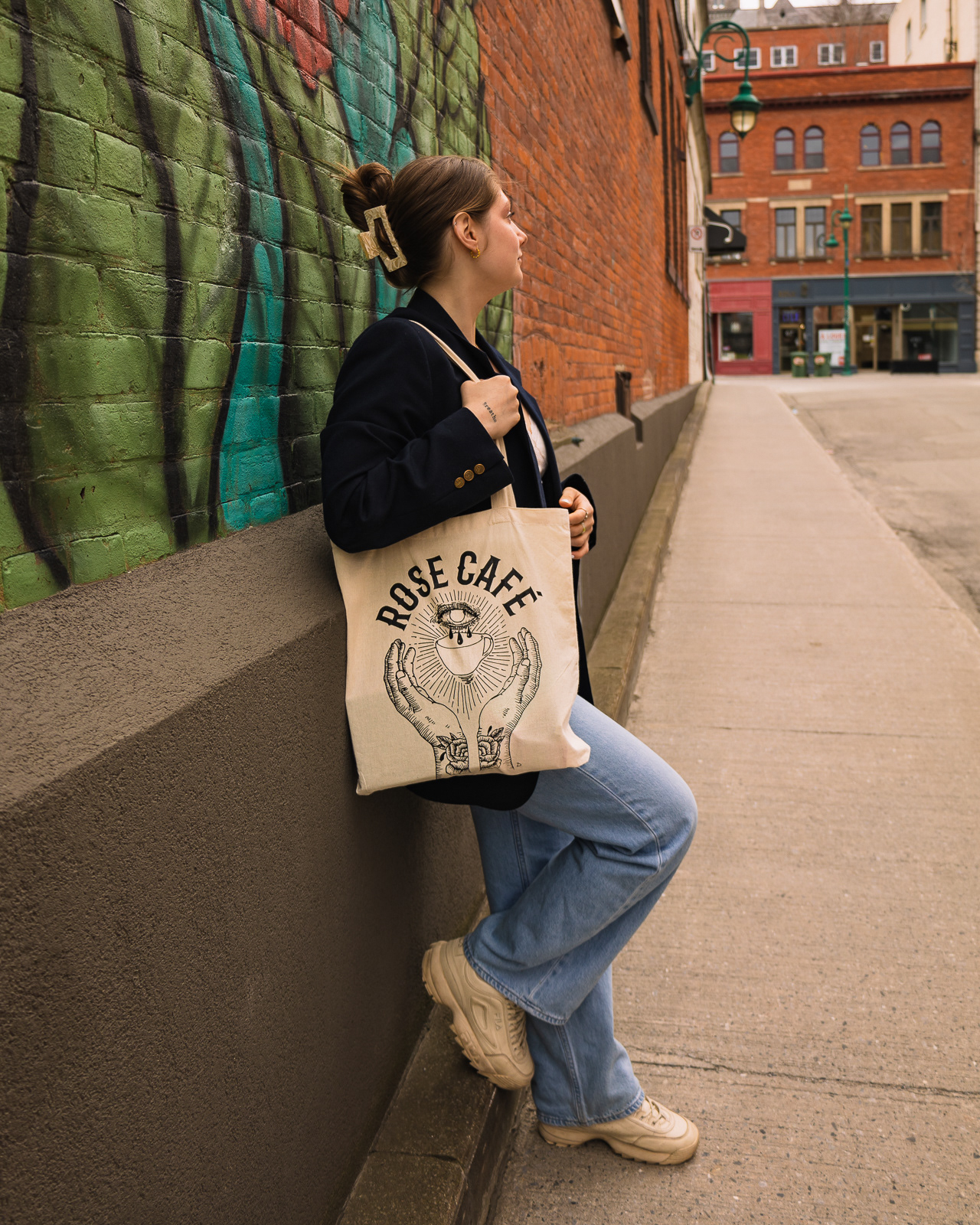 Woman holding a tote bag for a product photoshoot