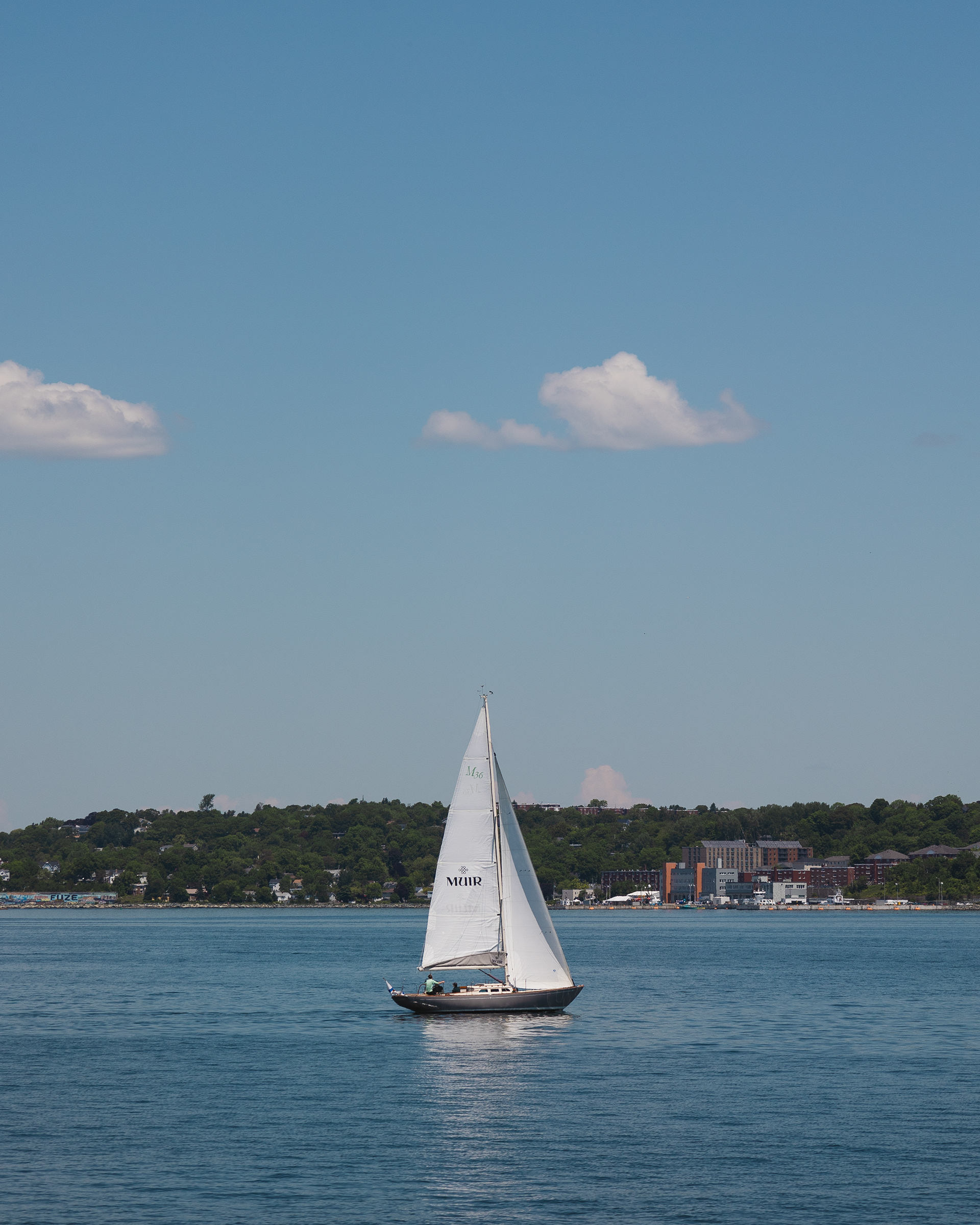 White sailboat on the Atlantic ocean in Halifax, Canada
