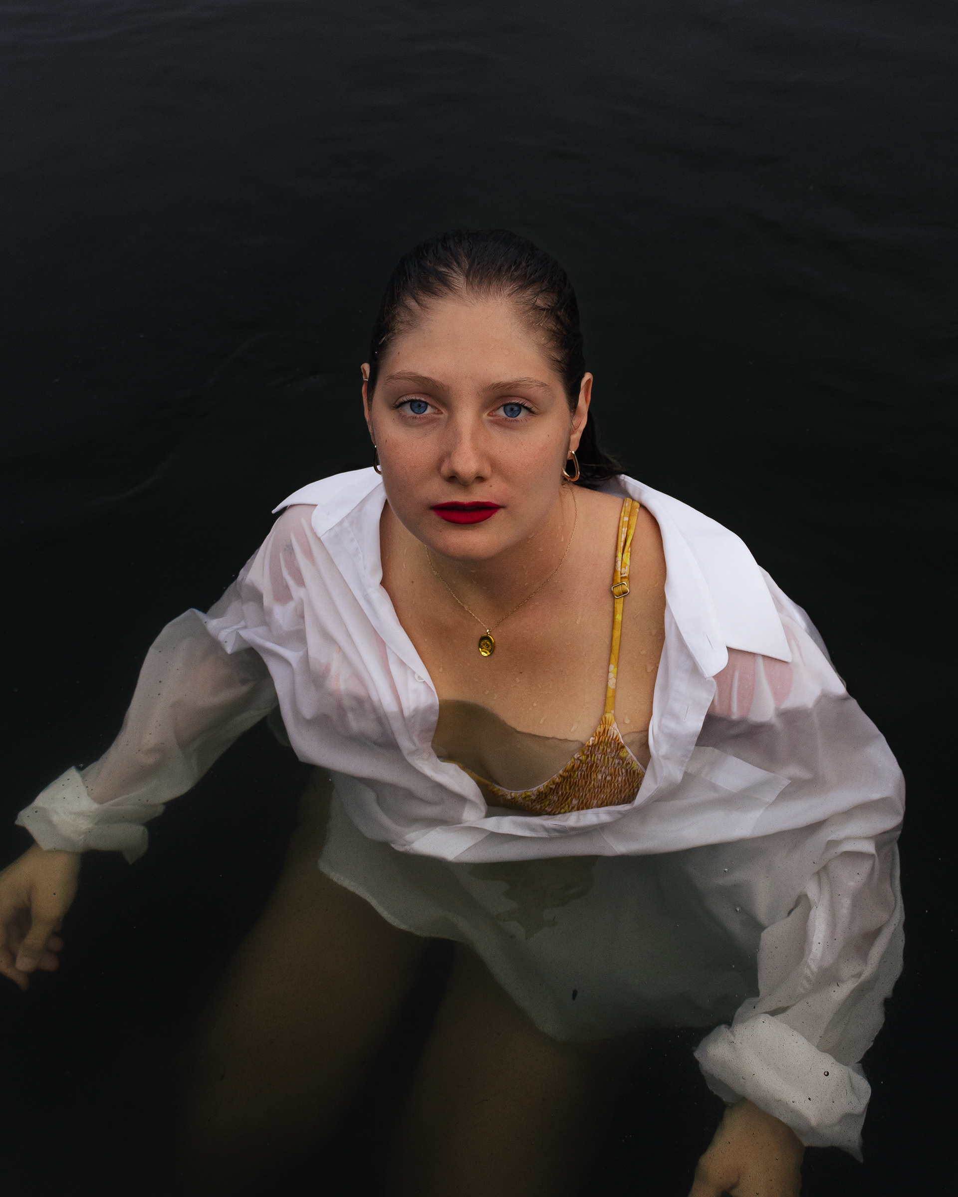 Woman posing in a dark lake in Montreal, Canada