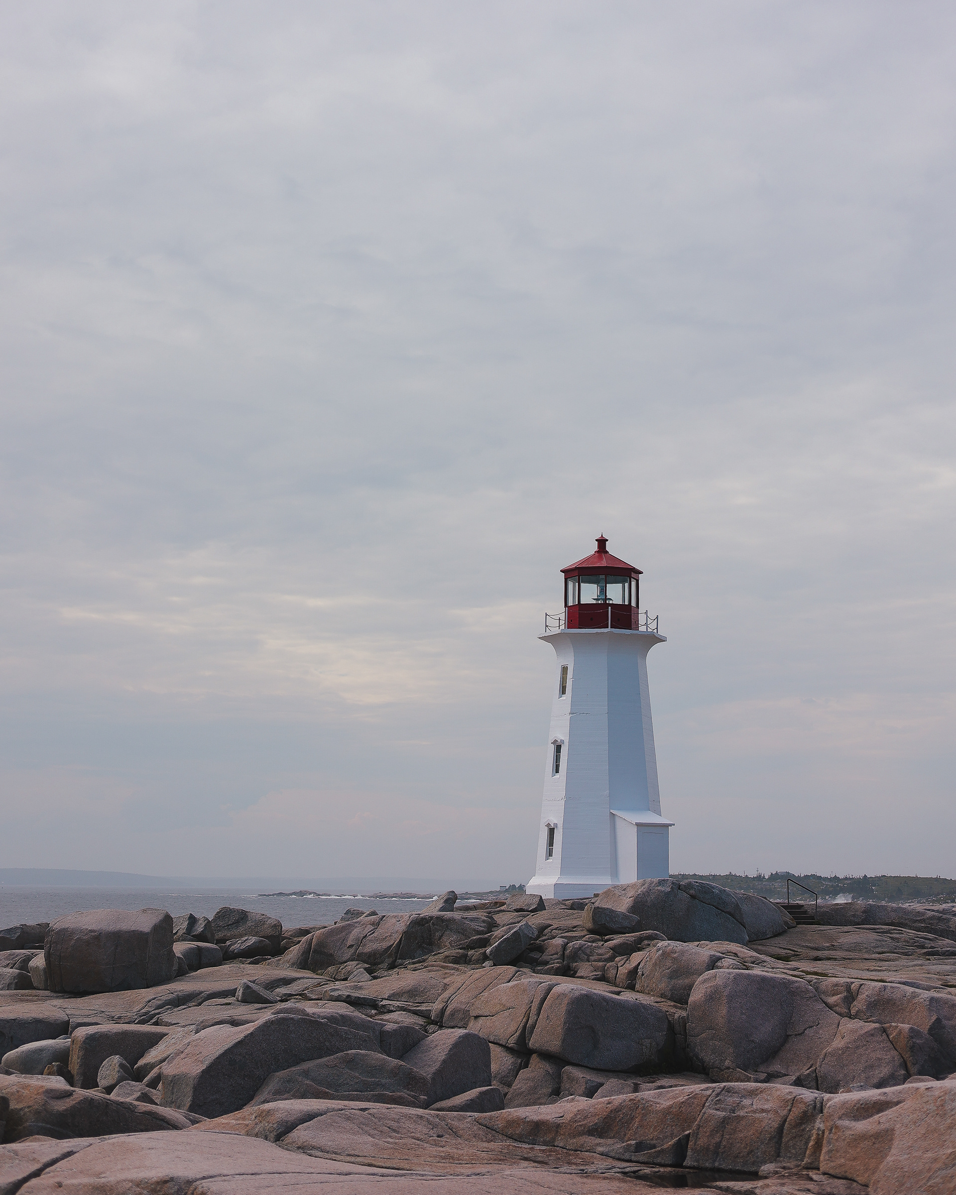 Red and white lighthouse in Peggy's Cove, Nova Scotia
