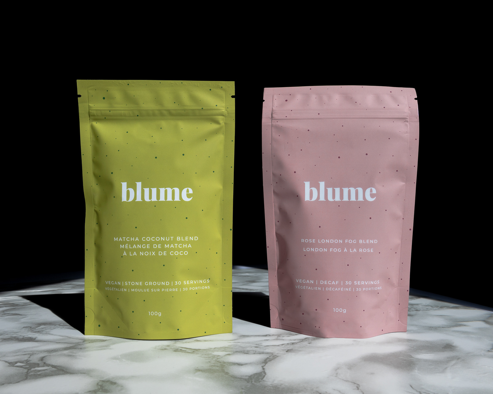 Two tea bags on a marble table and a black background