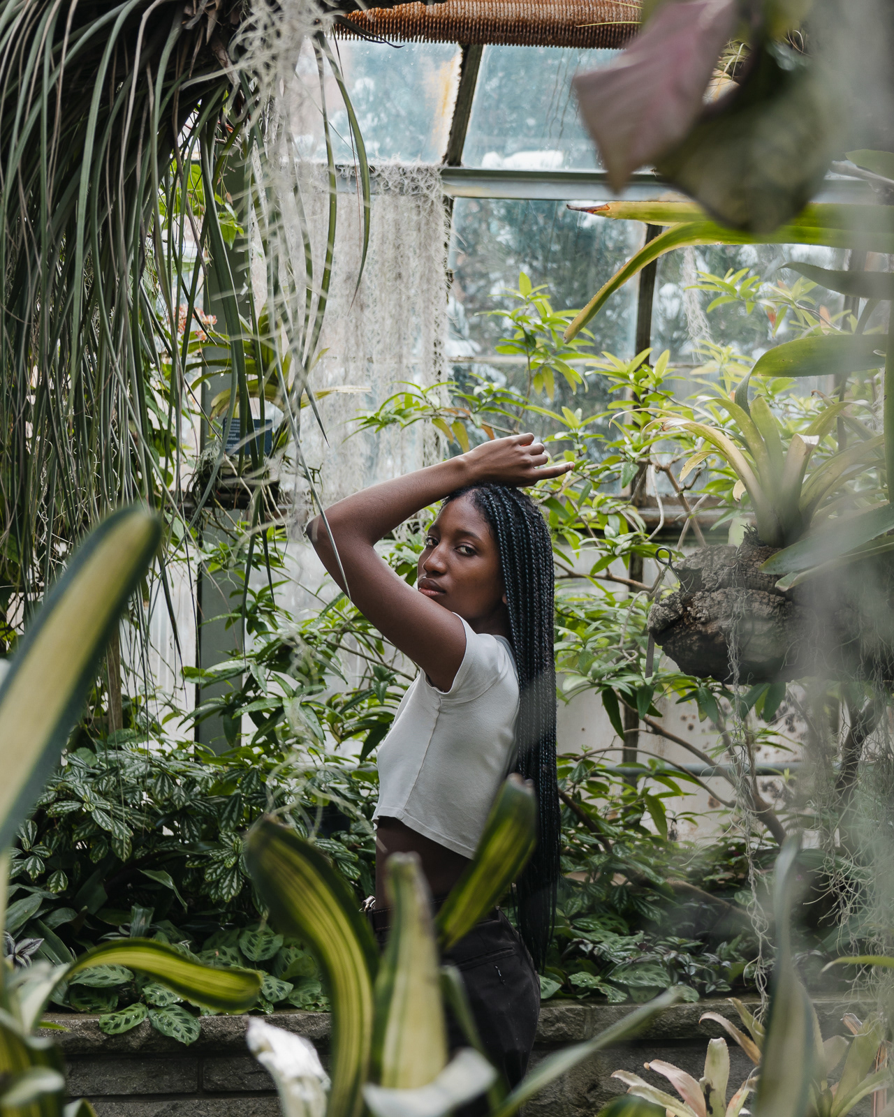 Portrait of a woman in a greenhouse in Montreal