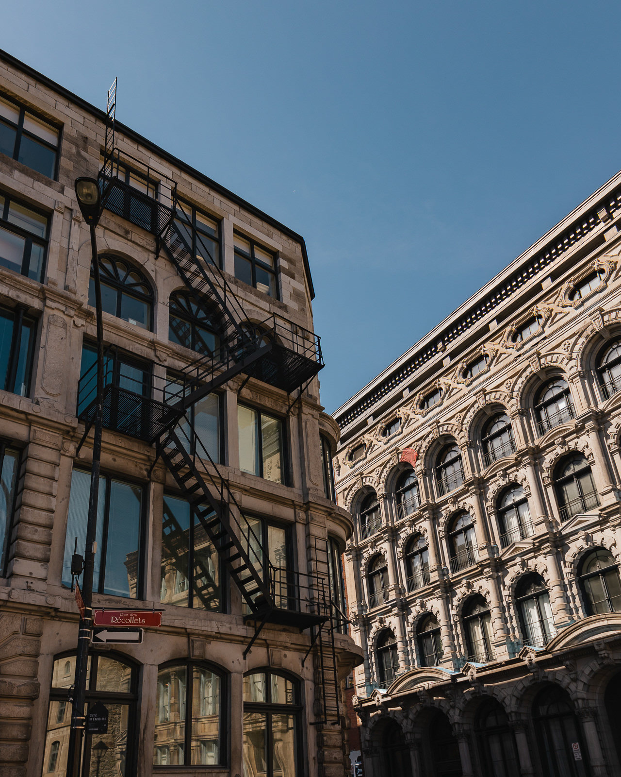 Old building facade with iron staircase in Old Port, Montreal