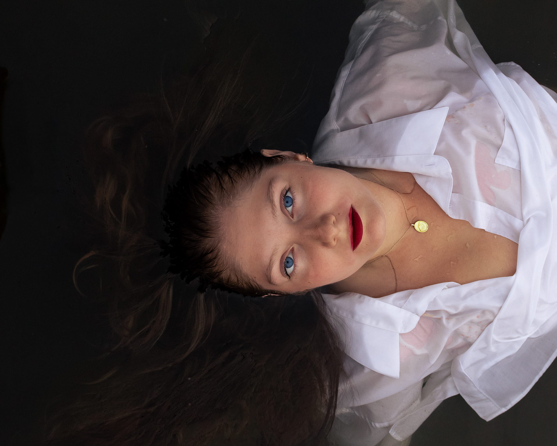 Woman posing in a dark lake in Montreal, Canada