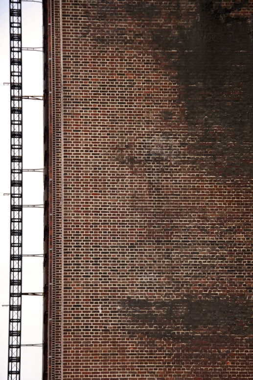 Ladder with brick wall (London, UK)