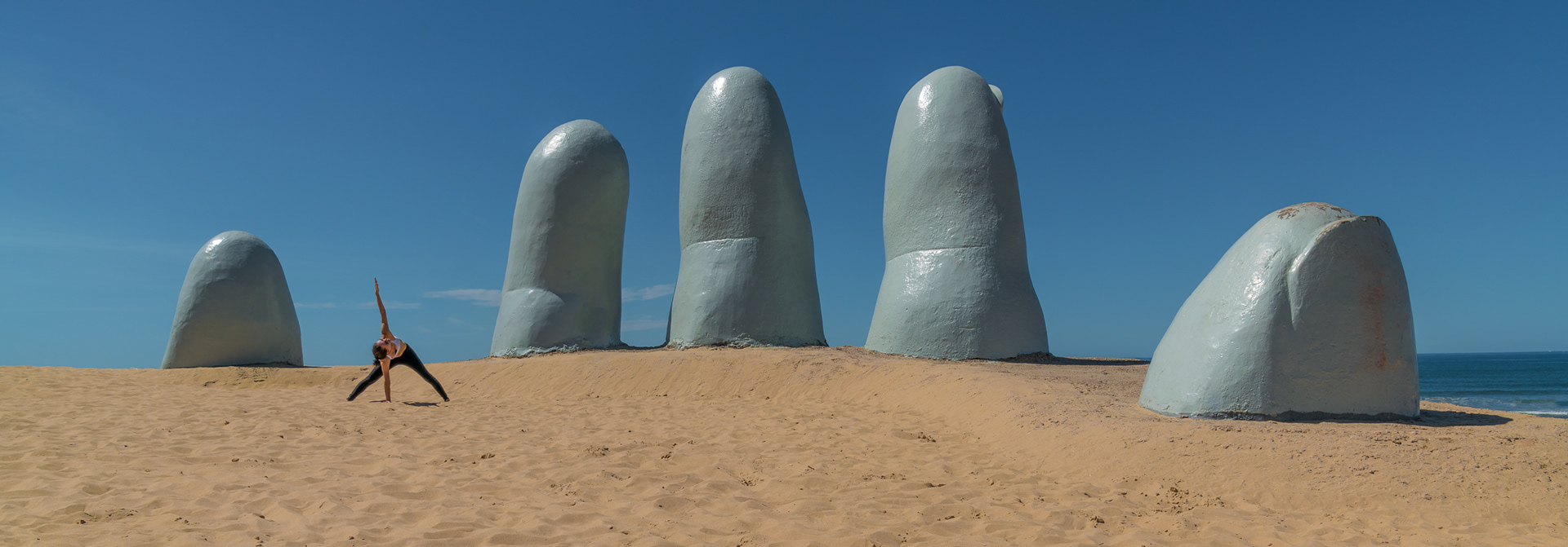Spinal Twist in Standing Separate Leg Stretch: Punta del Este, Uruguay