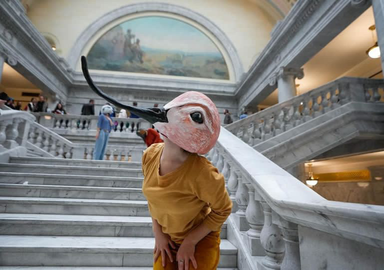 A 2024 collaborative performance piece made with Great Salt Lake, Bryn Watkins, and Rae Luebbert. This work brought three species into the Utah legislative session. Photo by Fransisco Kjolseth. Masks by String and Shadow.