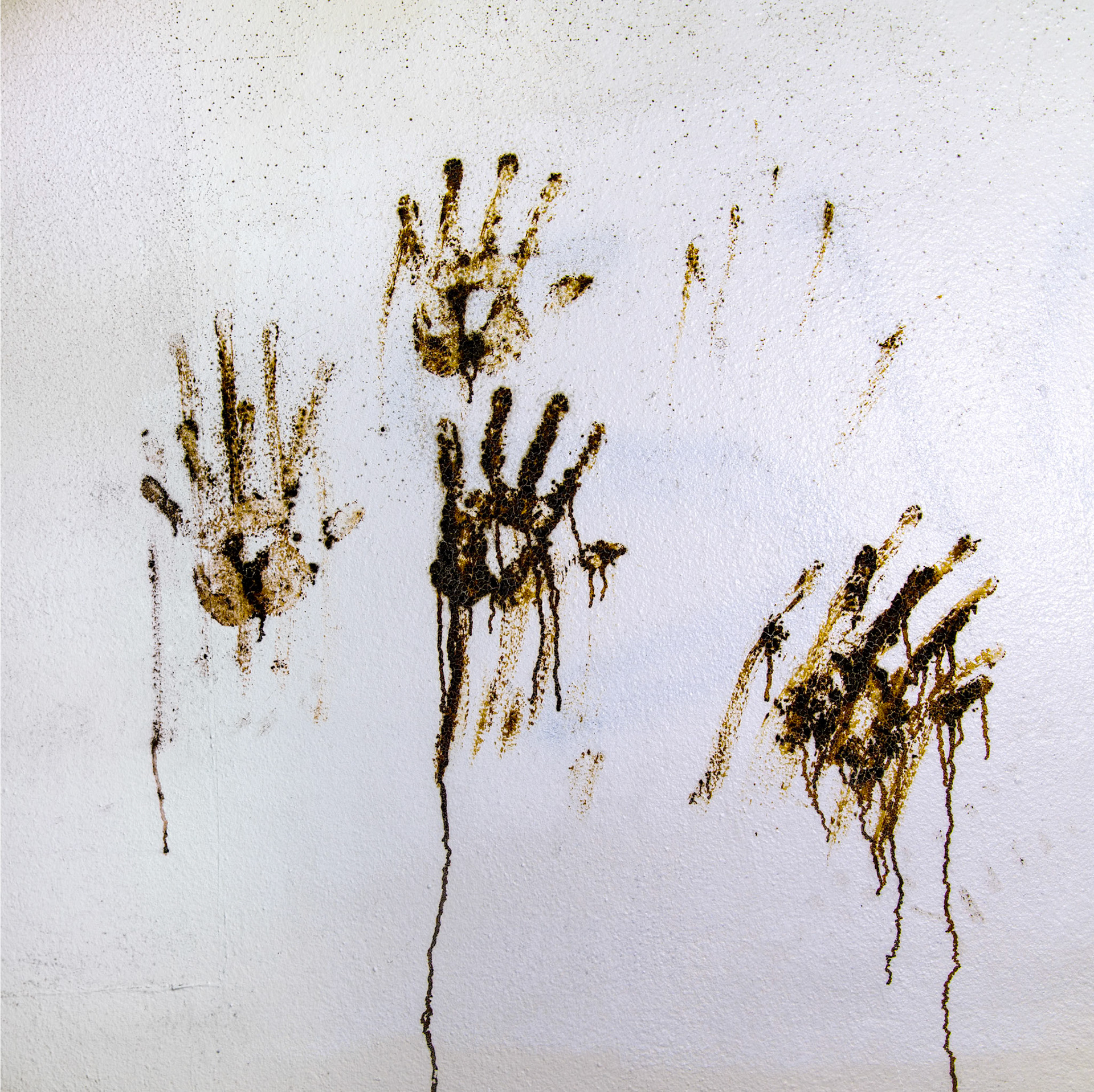 Hand prints at wall