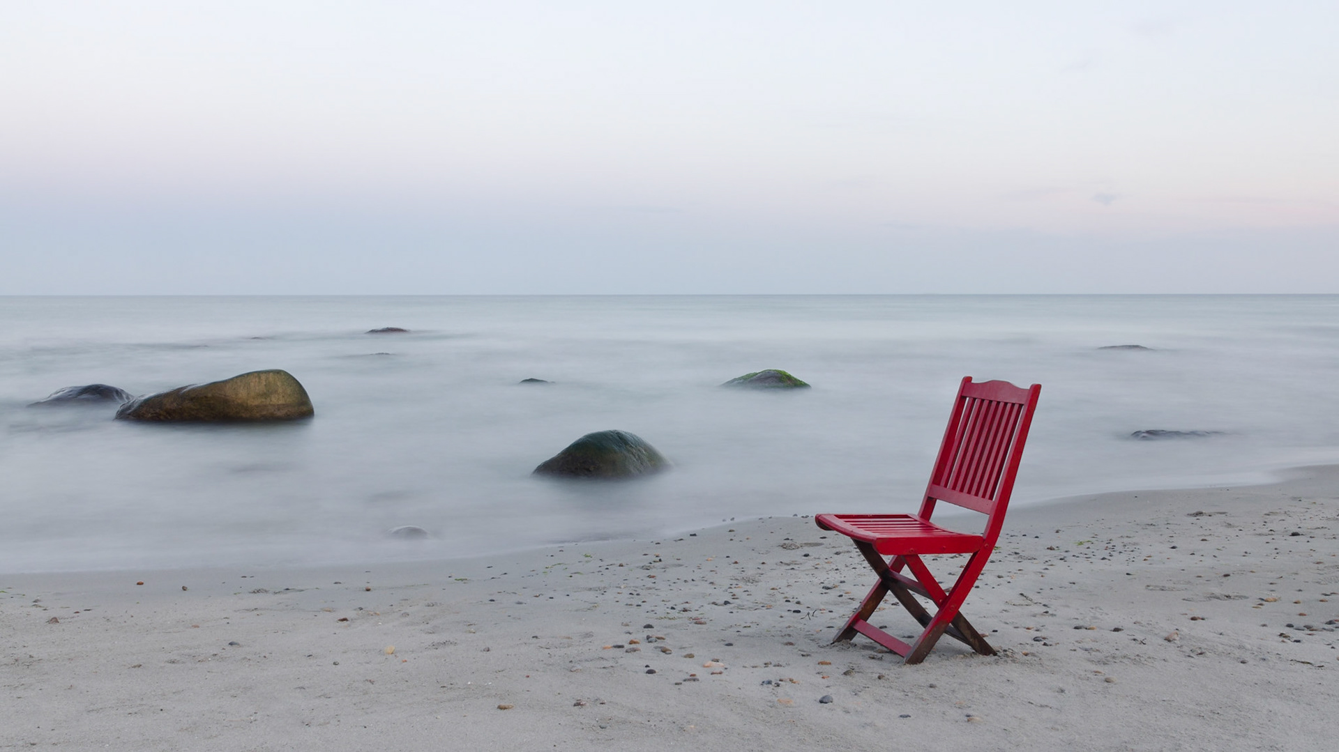 Red chair by the sea