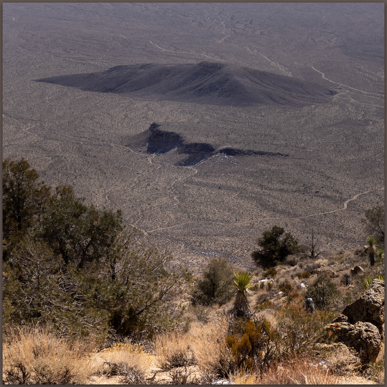 Alluvial island. An inselberg sits above the alluvial fans of Bonnie Claire Flat, Mojave Desert, NV, USA