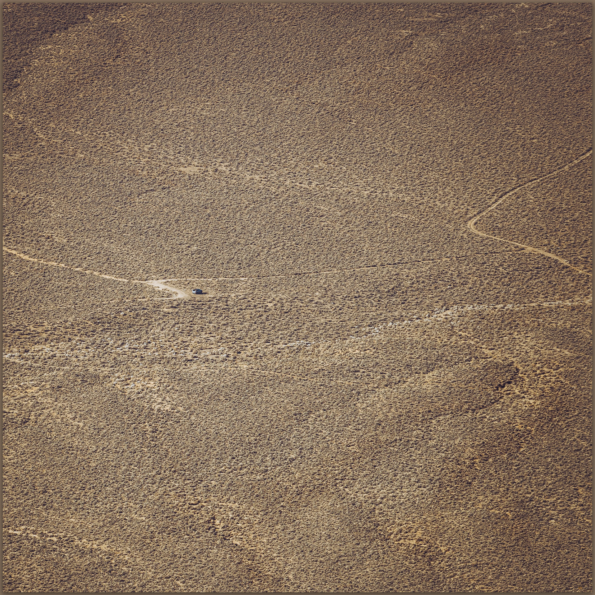 The truck sits on the fan below Juniper Mountain, Great Basin Desert, NV, USA