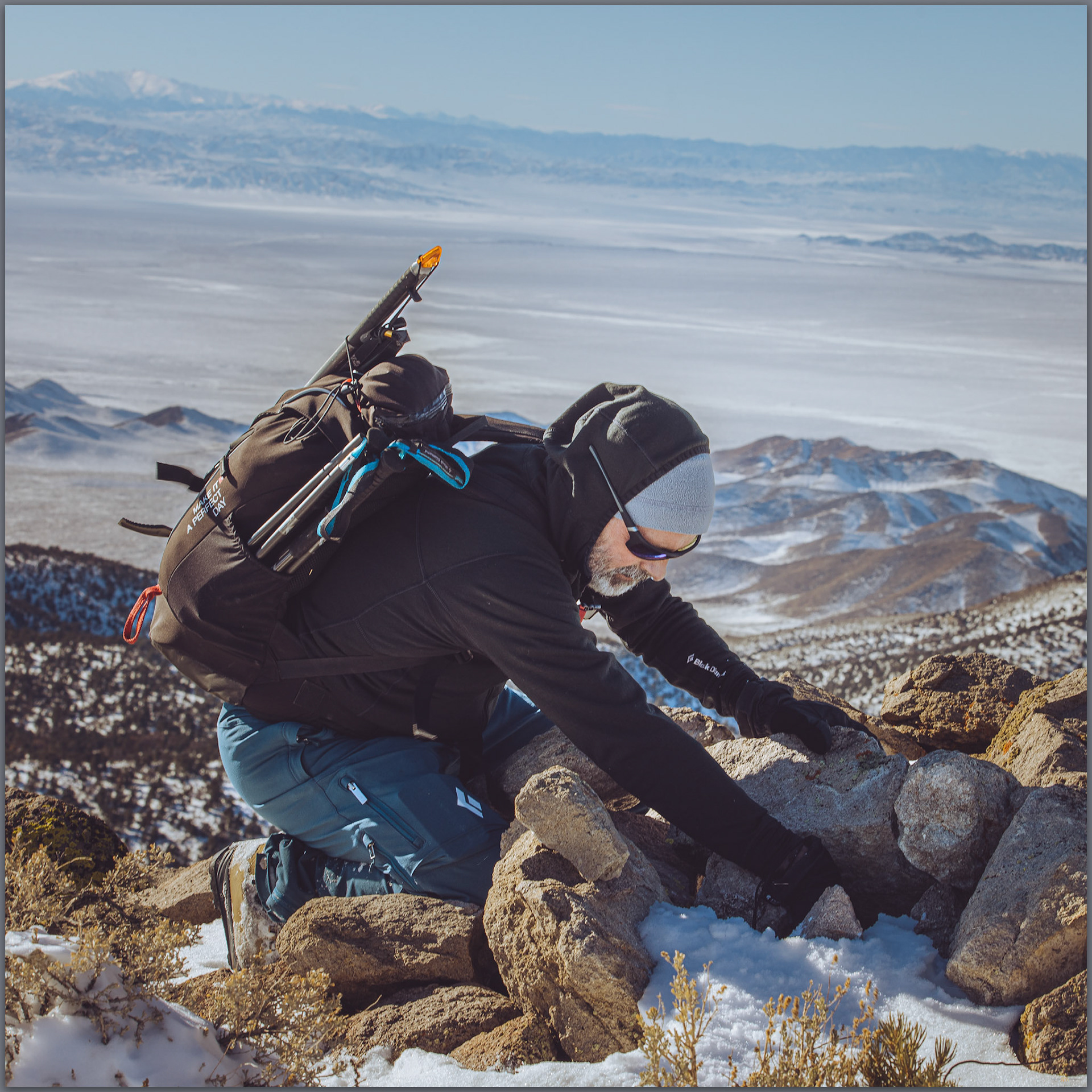 Darren finds the register in the typical summit cairn, Paradise Range, Great Basin Desert, NV, USA