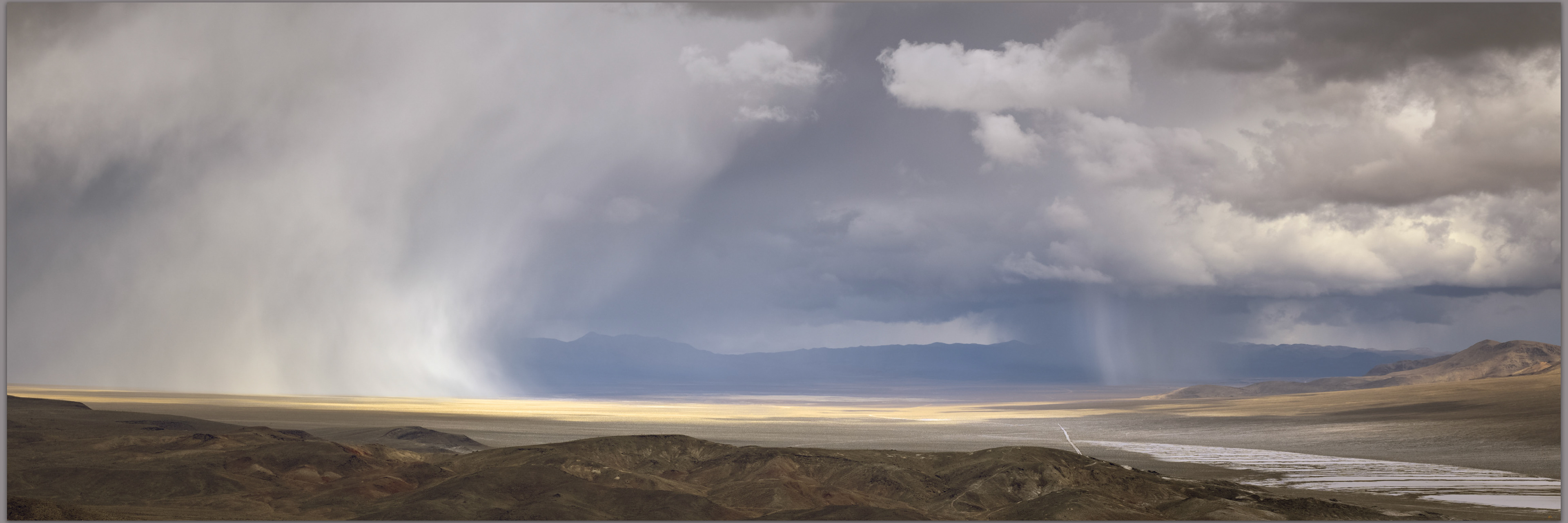Torrential graupel storms track across Stonewall Valley toward Mud Lake playa, Cuprite Hills, Mojave Desert, Nevada, USA