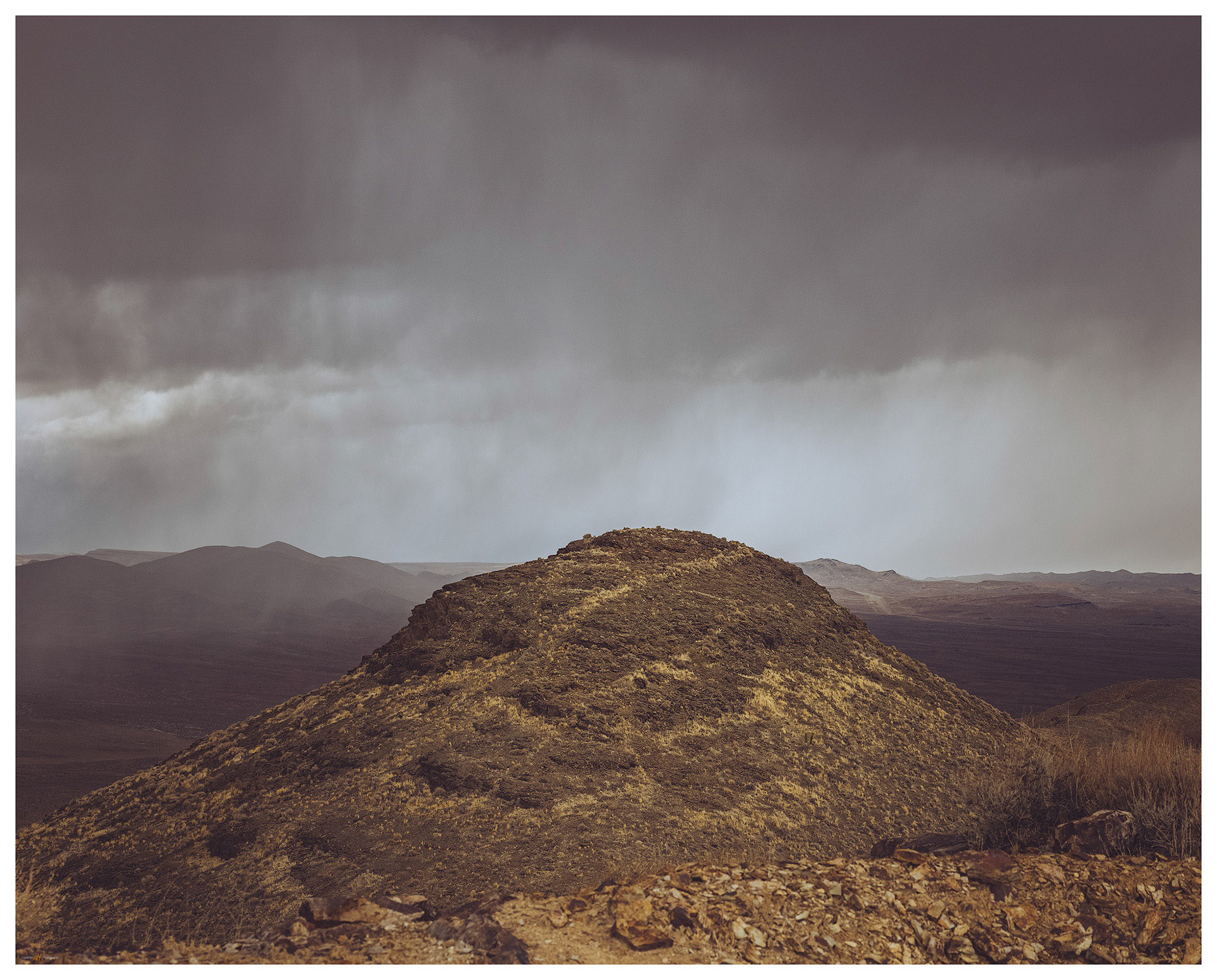 Peak 6107 - the Cuprite HIlls highpoint; the storm providing drama for a typically undramatic hill.