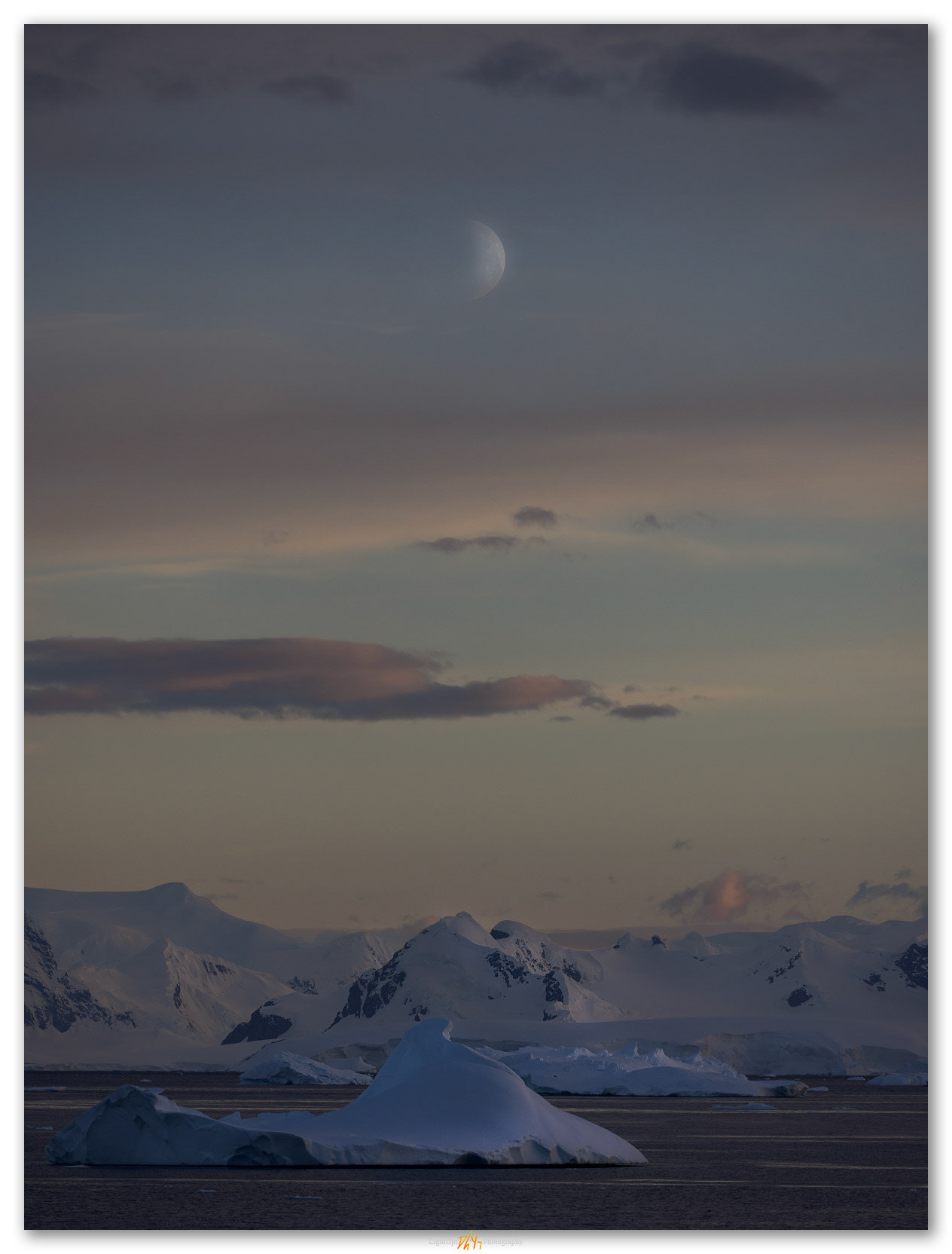 Austral moon. The moon appears in the mist of the Antarctica Peninsula.