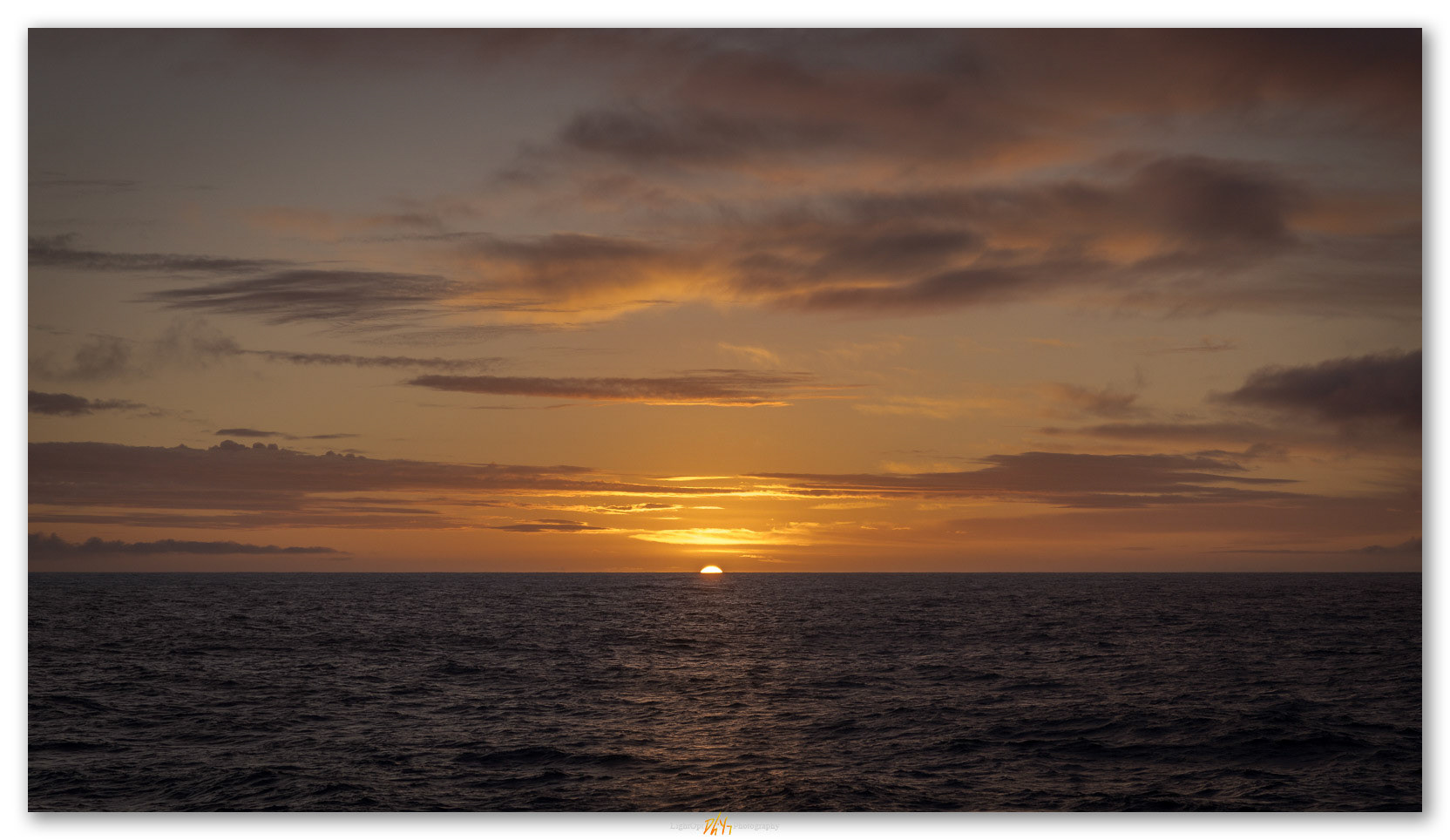 First dawn at sea. Sunrise on first morning beyond Beagle Channel, entering Southern Ocean on voyage to Antarctica