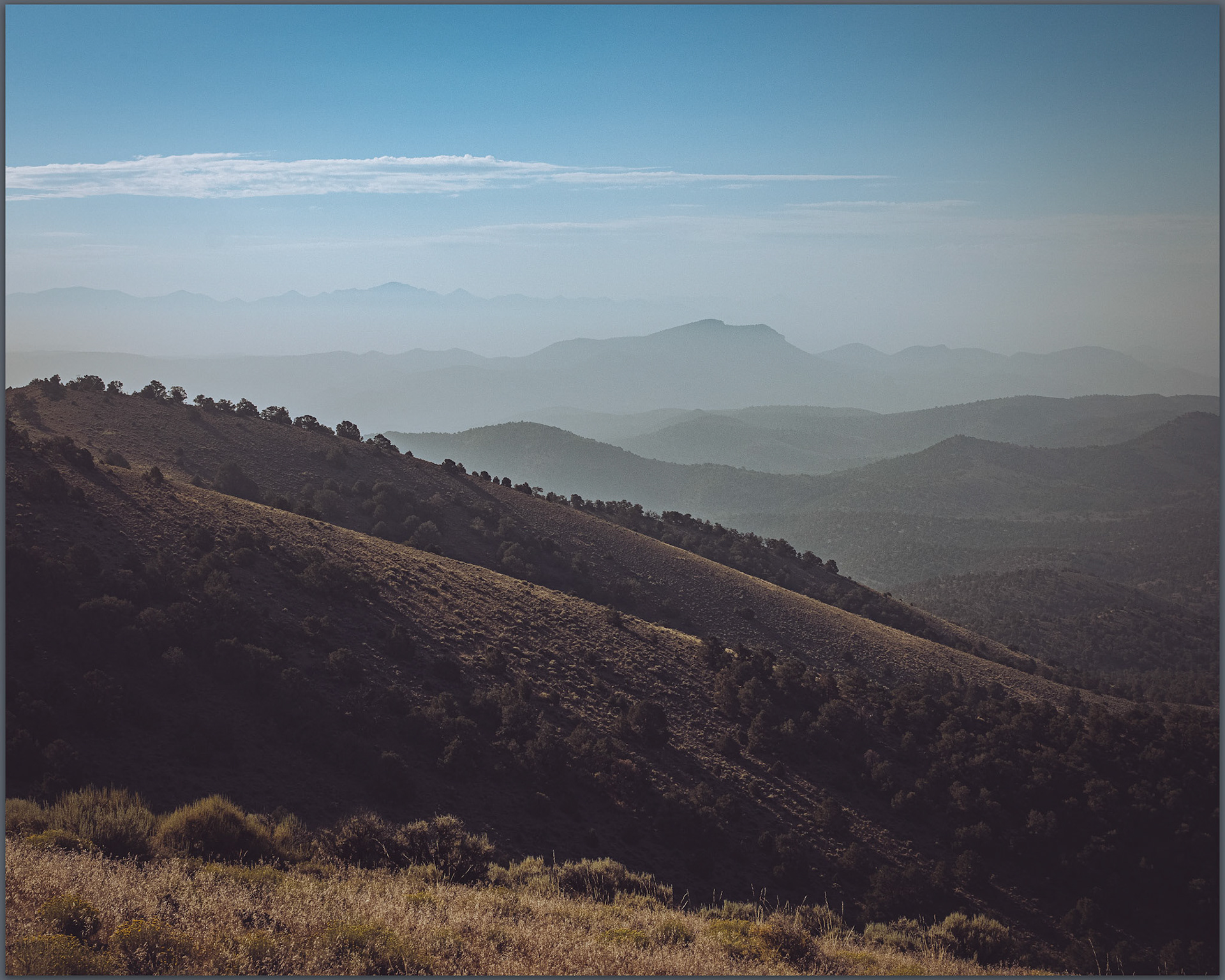 Morning haze divides the Eastgate Range, Great Basin Desert, Nevada, USA