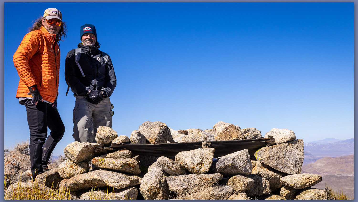 Summit time. The brothers at the summit cairn of Gold Mountain, Mojave Desert, NV, USA