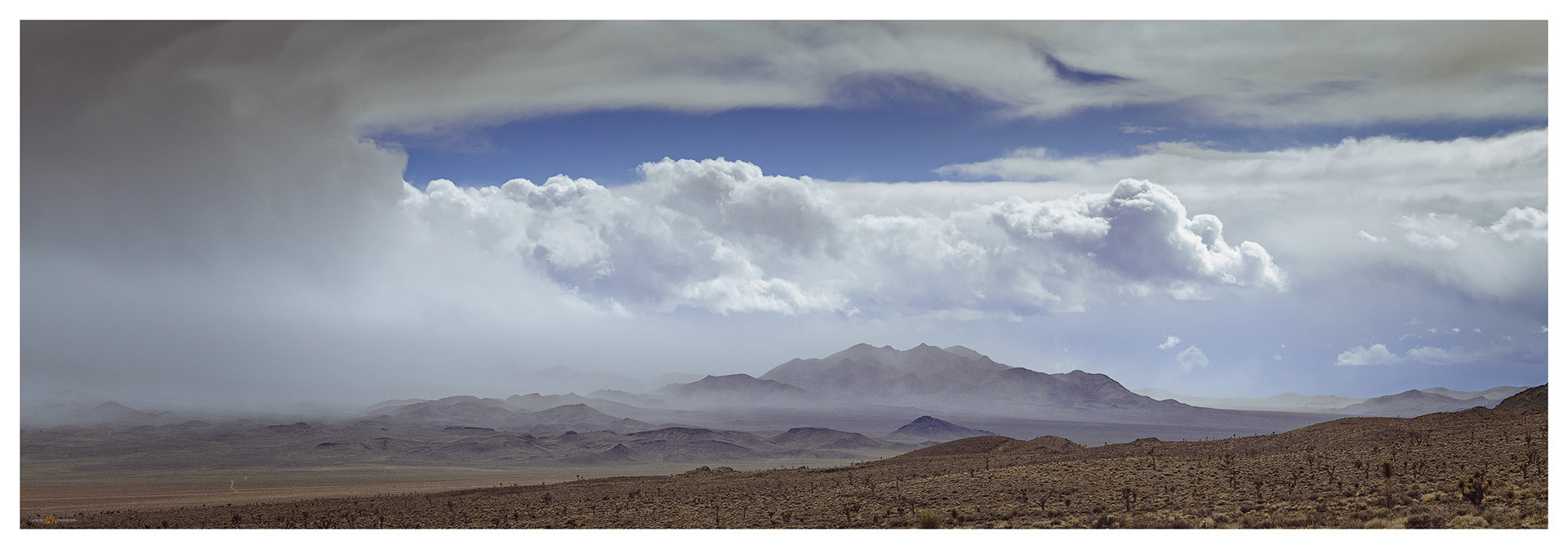 Dust and snow swirl around Mount Dunfee to the southwest.